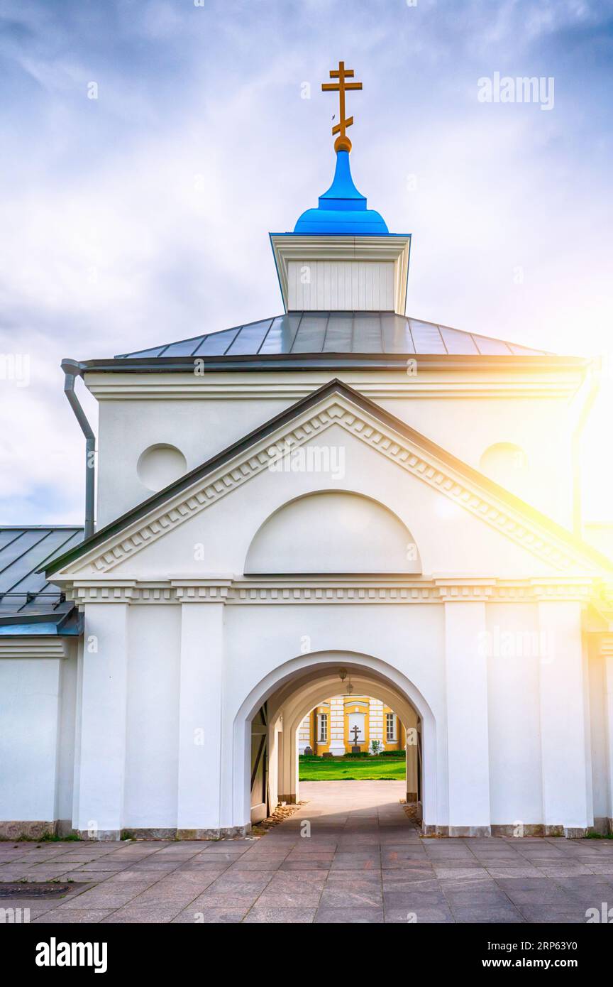 Konevsky Monastery on Konevets Island on Lake Ladoga - Russia. The central entrance with the gate church on the zakta in the sunlight. Stock Photo
