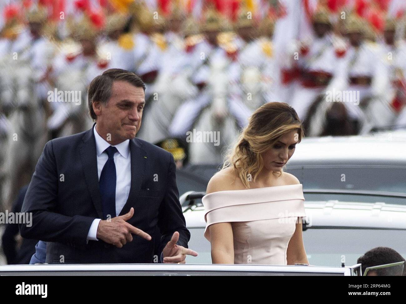 (190101) -- BRASILIA, Jan. 1, 2019 -- Photo provided by Agencia Estado shows Brazil s President-elect Jair Bolsonaro (L) and his wife Michelle Bolsonaro arriving at Brazil s National Congress prior to his inauguration ceremony in Brasilia, Brazil, on Jan. 1, 2019. Brazil s President-elect Jair Bolsonaro will be sworn in on Tuesday amid tight security, including more than 3,200 civilian and military security personnel, combat aircraft and surface-to-air missiles.AGENCIA ESTADO/Andressa Anholete) ***BRAZIL OUT*** BRAZIL-BRASILIA-PRESIDENT-ELECT-JAIR BOLSONARO-INAUGURATION AE PUBLICATIONxNOTxINxC Stock Photo