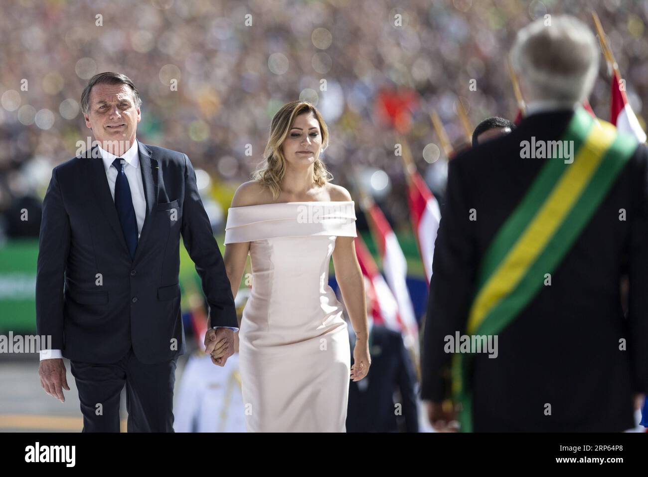 (190101) -- BRASILIA, Jan. 1, 2019 -- Jair Bolsonaro (1st L) and his wife Michelle Bolsonaro attend the inauguration ceremony in Brasilia, capital of Brazil, on Jan. 1, 2019. Army captain-turned-politician Jair Bolsonaro was sworn in as Brazil s president on Tuesday amid heightened security. ) BRAZIL-BRASILIA-JAIR BOLSONARO-PRESIDENT-INAUGURATION LixMing PUBLICATIONxNOTxINxCHN Stock Photo