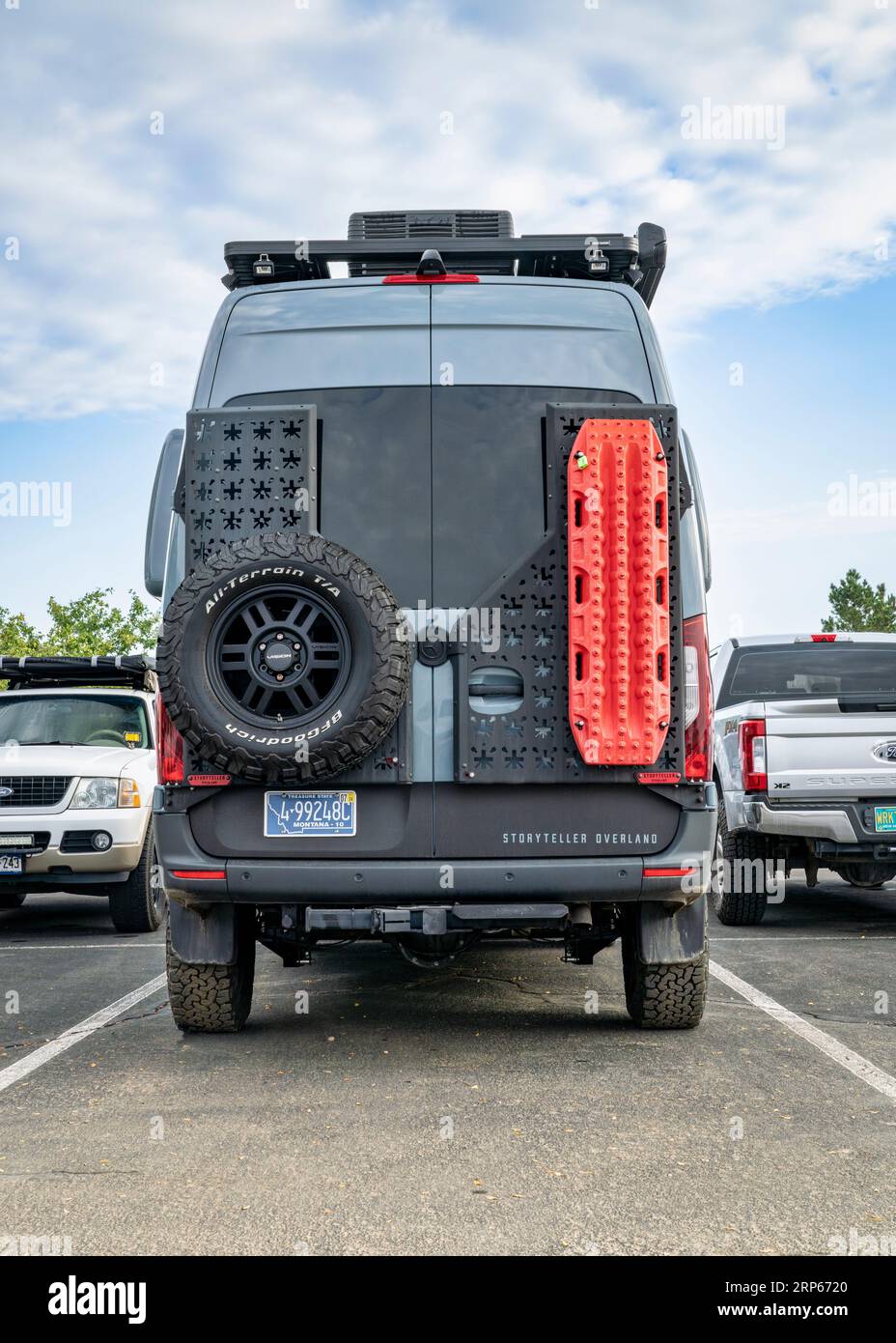 Loveland, CO, USA - August 26, 2023: Back of Storyteller Overland Beast Mode, 4x4 camper van on Mercedes Sprinter chassis with a spare tire and rack w Stock Photo