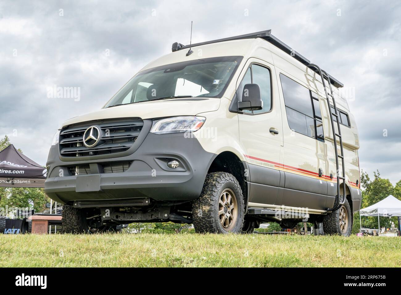 Loveland, CO, USA - August 25, 2023: Storyteller Overland Mode, 4x4 camper van on Mercedes Sprinter chassis at a busy campground. Stock Photo