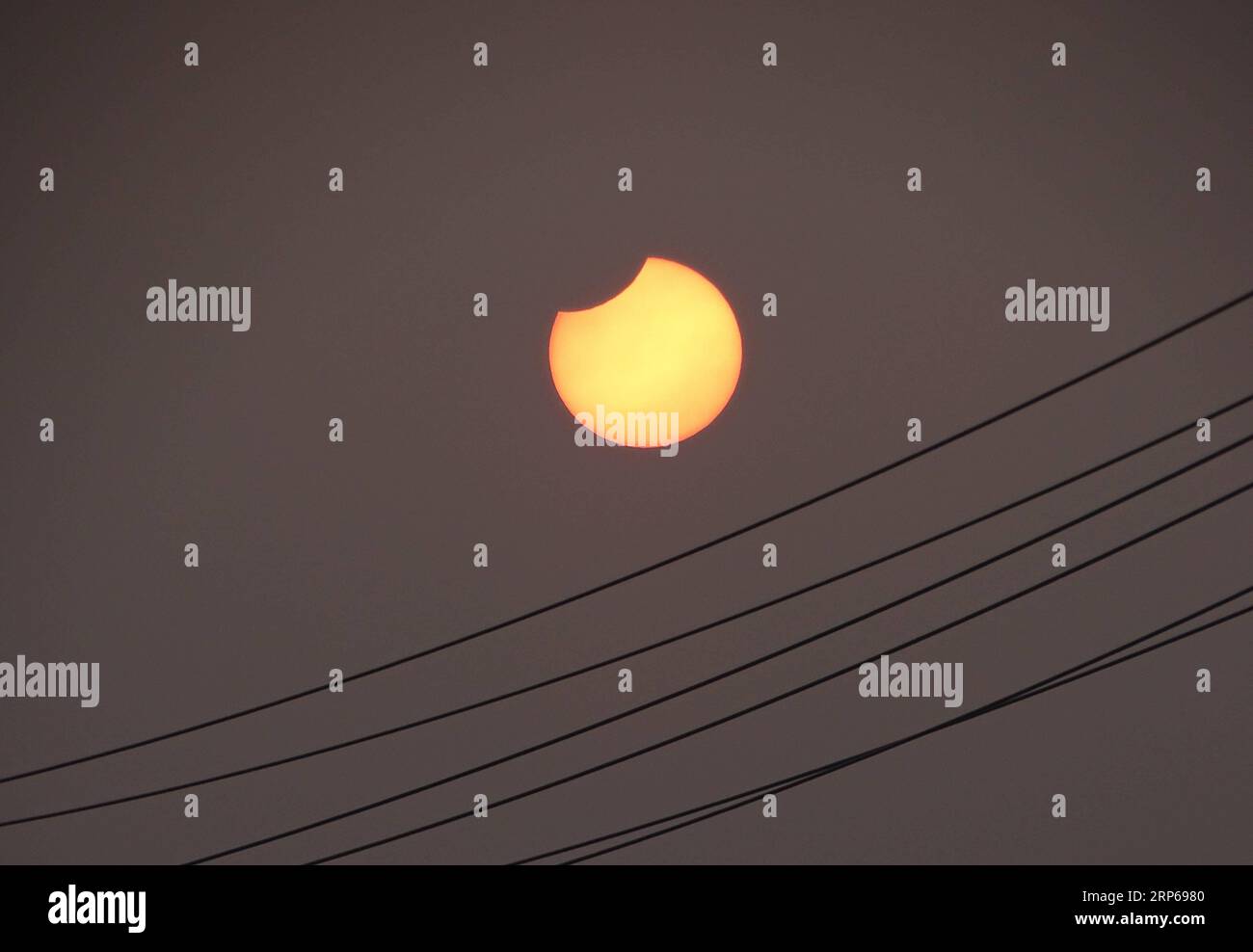 (190106) -- JINING, Jan. 6, 2019 -- A partial solar eclipse is observed as the moon passes in front of the sun in Dashu Township of Zoucheng City, east China s Shandong Province, Jan. 6, 2019. ) CHINA-PARTIAL SOLAR ECLIPSE (CN) WangxQisheng PUBLICATIONxNOTxINxCHN Stock Photo