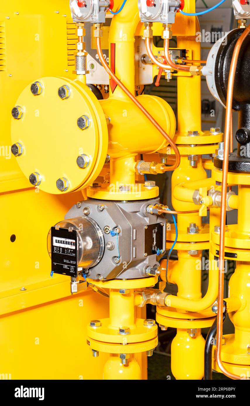 Rotary gas meter with filters and nozzles in a fragment of the gas control station system. Stock Photo