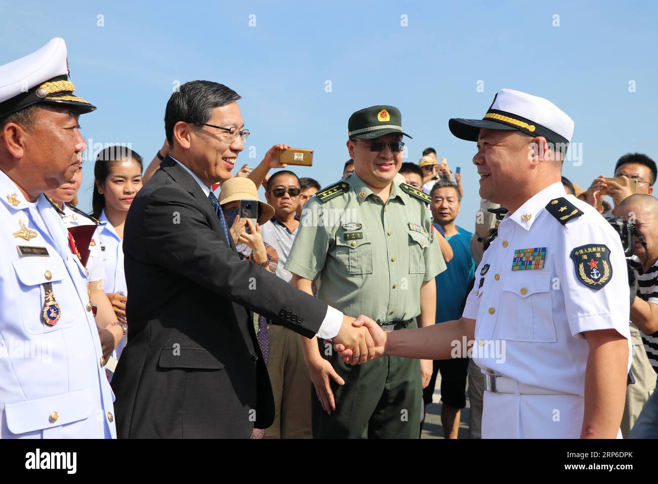 (190110) -- SIHANOUKVILLE, Jan. 10, 2019 -- Rear Admiral Xu Haihua (R), commander of the 30th fleet of Chinese navy escort, shakes hands with Chinese Ambassador to Cambodia Wang Wentian during a welcoming ceremony at Sihanoukville Autonomous Port, Cambodia, Jan. 9, 2019. The 30th Chinese naval escorting fleet, composed of missile frigates Wuhu and Handan , and supply ship Dongpinghu , arrived Wednesday at the Sihanoukville Autonomous Port for a four-day friendly visit to Cambodia. ) CAMBODIA-SIHANOUKVILLE-CHINA-NAVY-VISIT MaoxPengfei PUBLICATIONxNOTxINxCHN Stock Photo