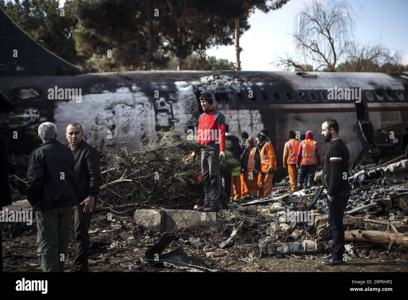 (190114) -- KARAJ, Jan. 14, 2019 -- Rescuers work at the crash site of a Boeing 707 plane in Karaj, Iran, Jan. 14, 2019. At least 15 people were killed on Monday in the crash. ) IRAN-KARAJ-PLANE CRASH AhmadxHalabisaz PUBLICATIONxNOTxINxCHN Stock Photo