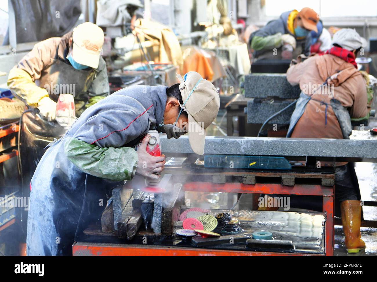 (190119) -- FUZHOU, Jan. 19, 2019 (Xinhua) -- Workers polish granite tombstones at a factory in Chongwu Township of Huian County, southeast China s Fujian Province, Jan. 17, 2019. Huian has developed a tombstone industry with more than 80 enterprises and over 30,000 workers. Tombstone products and stone materials are sold mainly to Japan and Europe. (Xinhua/Wei Peiquan) CHINA-FUJIAN-HUIAN-TOMBSTONE INDUSTRY (CN) PUBLICATIONxNOTxINxCHN Stock Photo