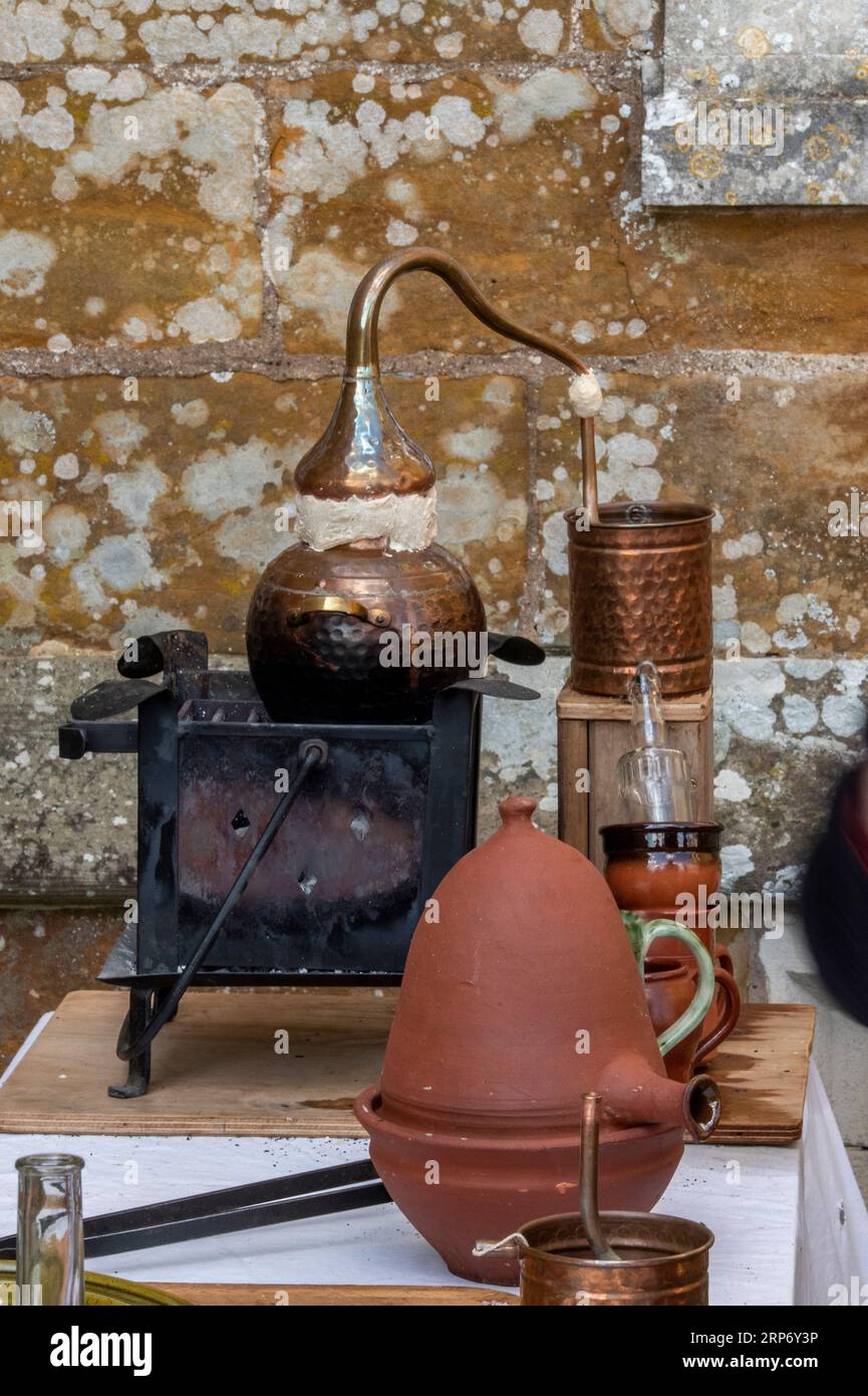 brewing equipment used in apothecary shop in tudor times. copper still and pipes for brewing tinctures, potions and lotions. Stock Photo