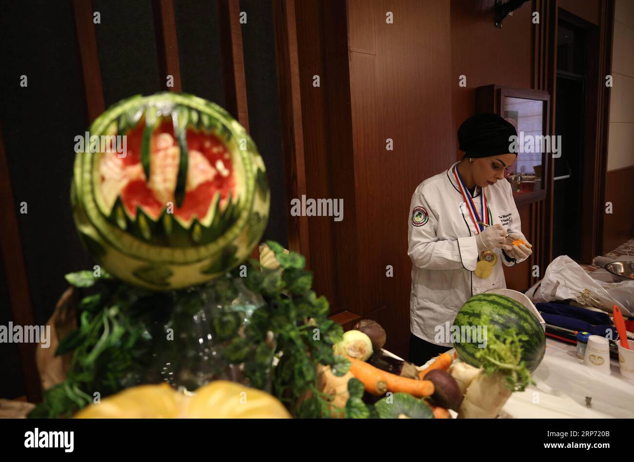 (190124) -- NABLUS, Jan. 24, 2019 -- A chef takes part in a national cooking contest in the West Bank City of Nablus, Jan. 22, 2019. Although similar to the general Mediterranean gastronomical culture, the Palestinian cuisine stands out with an array of tasteful spices and herbs. The newly established master chefs association in Palestine organized a national cooking contest, with the aim of choosing the winning chefs to join a national team that will be trained to compete internationally. Over 150 Palestinian chefs gathered at the contest for three days in West Bank s Nablus city, presenting Stock Photo