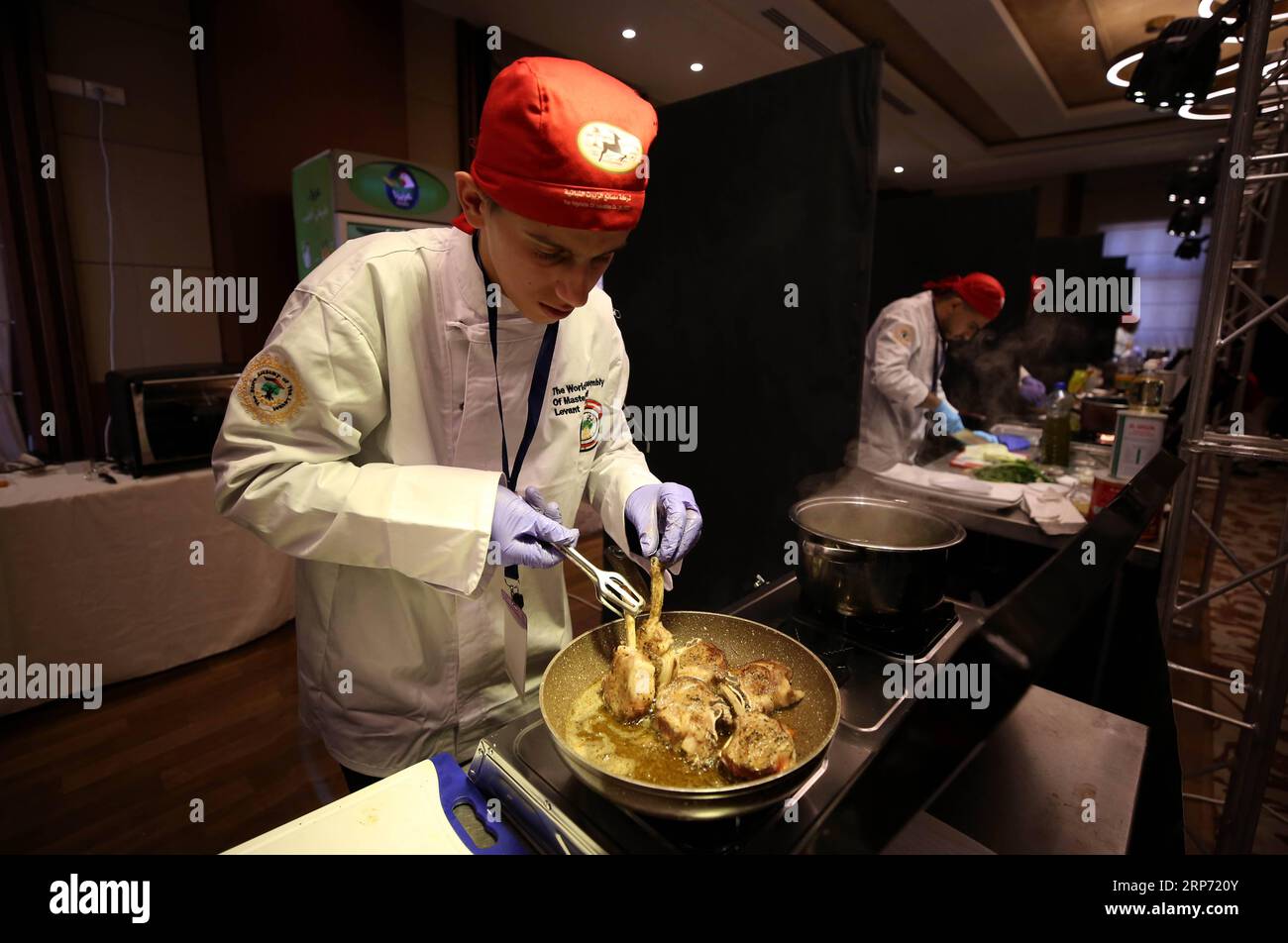 (190124) -- NABLUS, Jan. 24, 2019 -- Chefs take part in a national cooking contest in the West Bank City of Nablus, Jan. 22, 2019. Although similar to the general Mediterranean gastronomical culture, the Palestinian cuisine stands out with an array of tasteful spices and herbs. The newly established master chefs association in Palestine organized a national cooking contest, with the aim of choosing the winning chefs to join a national team that will be trained to compete internationally. Over 150 Palestinian chefs gathered at the contest for three days in West Bank s Nablus city, presenting tr Stock Photo