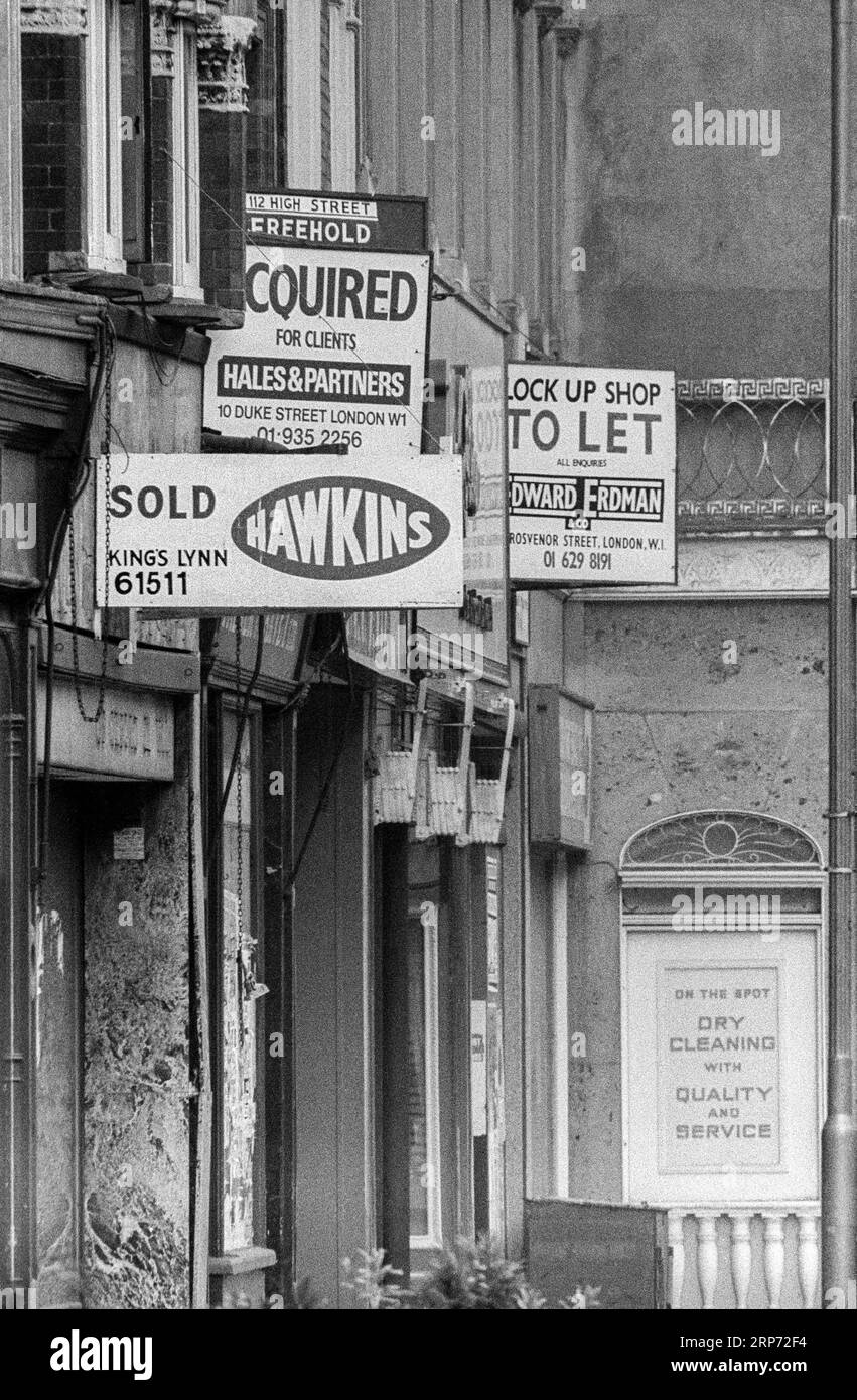 Early 1970s black & white archive photograph of estate agents boards in