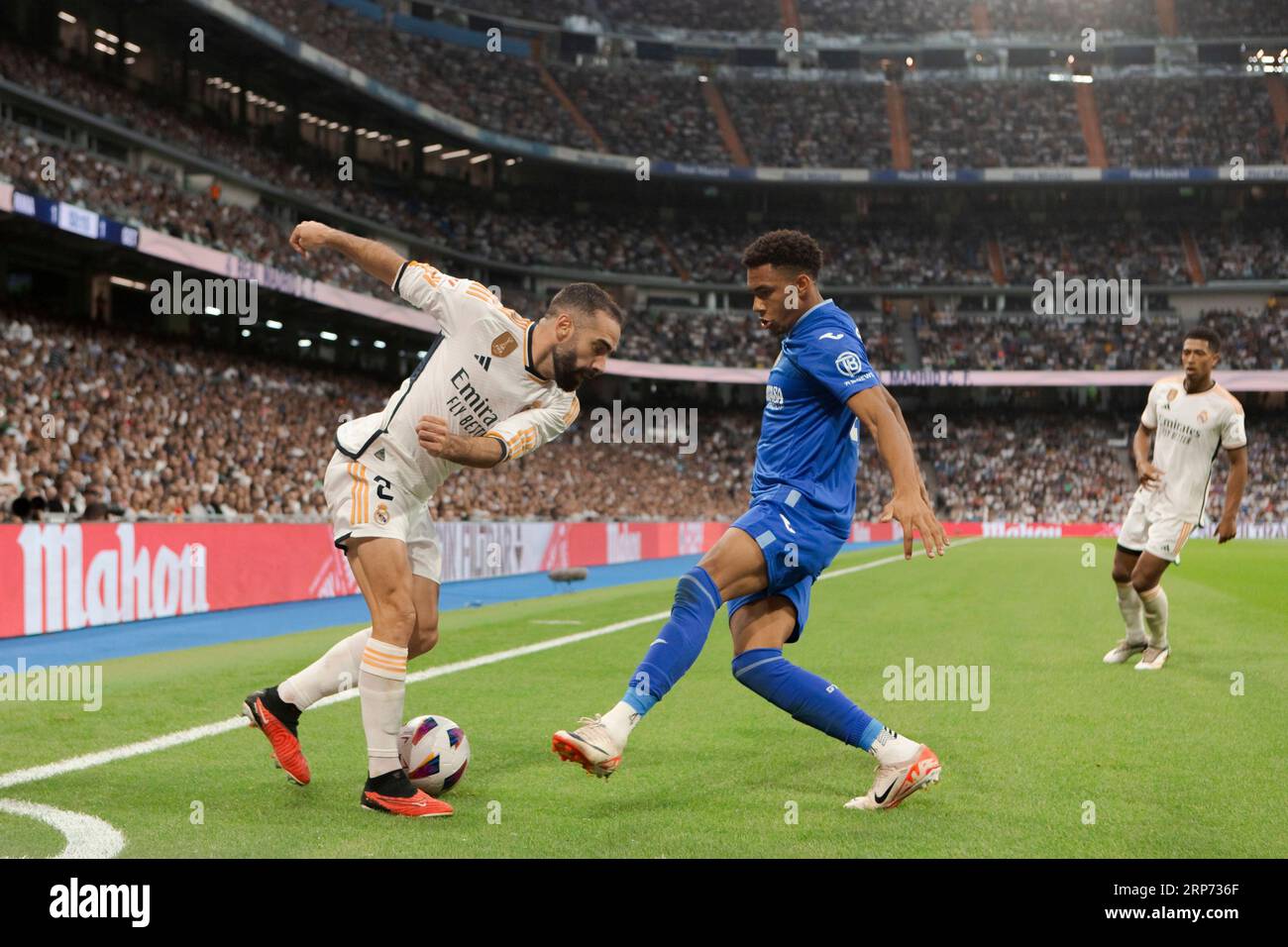 Daniel Carvajal (L) of Real Madrid seen in action during the LaLiga EA Sports 2023/24 match between Real Madrid and Getafe at Santiago Bernabeu Stadium. Final score; Real Madrid 2:1 Getafe. Stock Photo
