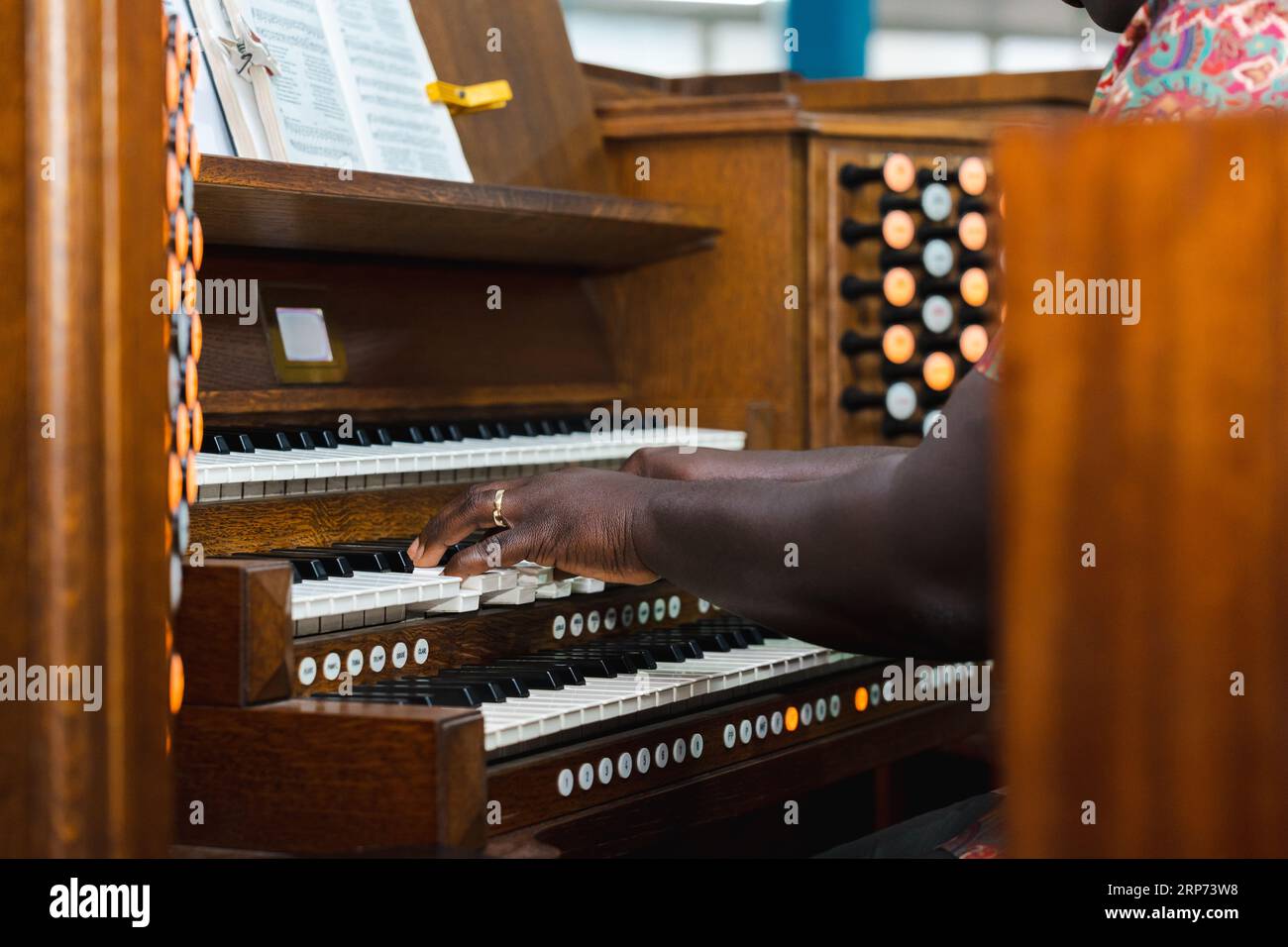 black man playing vintage organ Stock Photo
