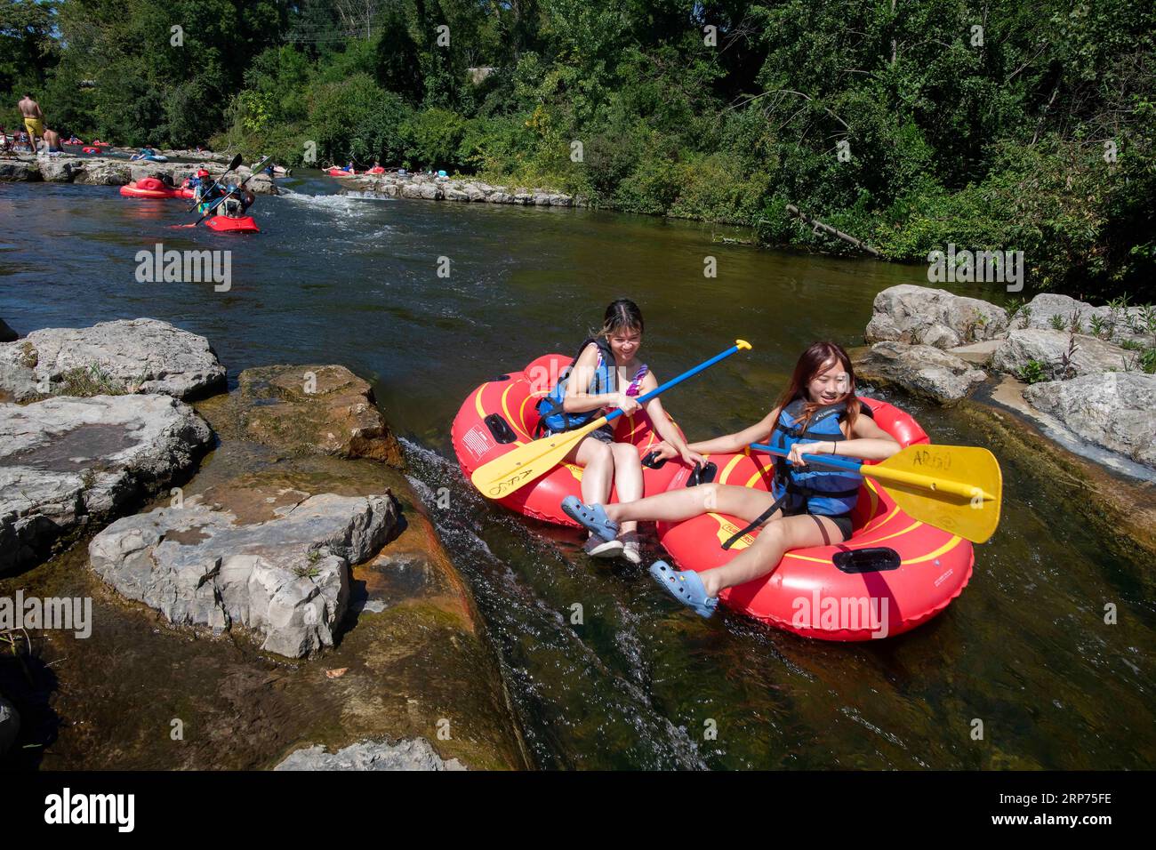 Kids tubing down river in hi-res stock photography and images - Alamy
