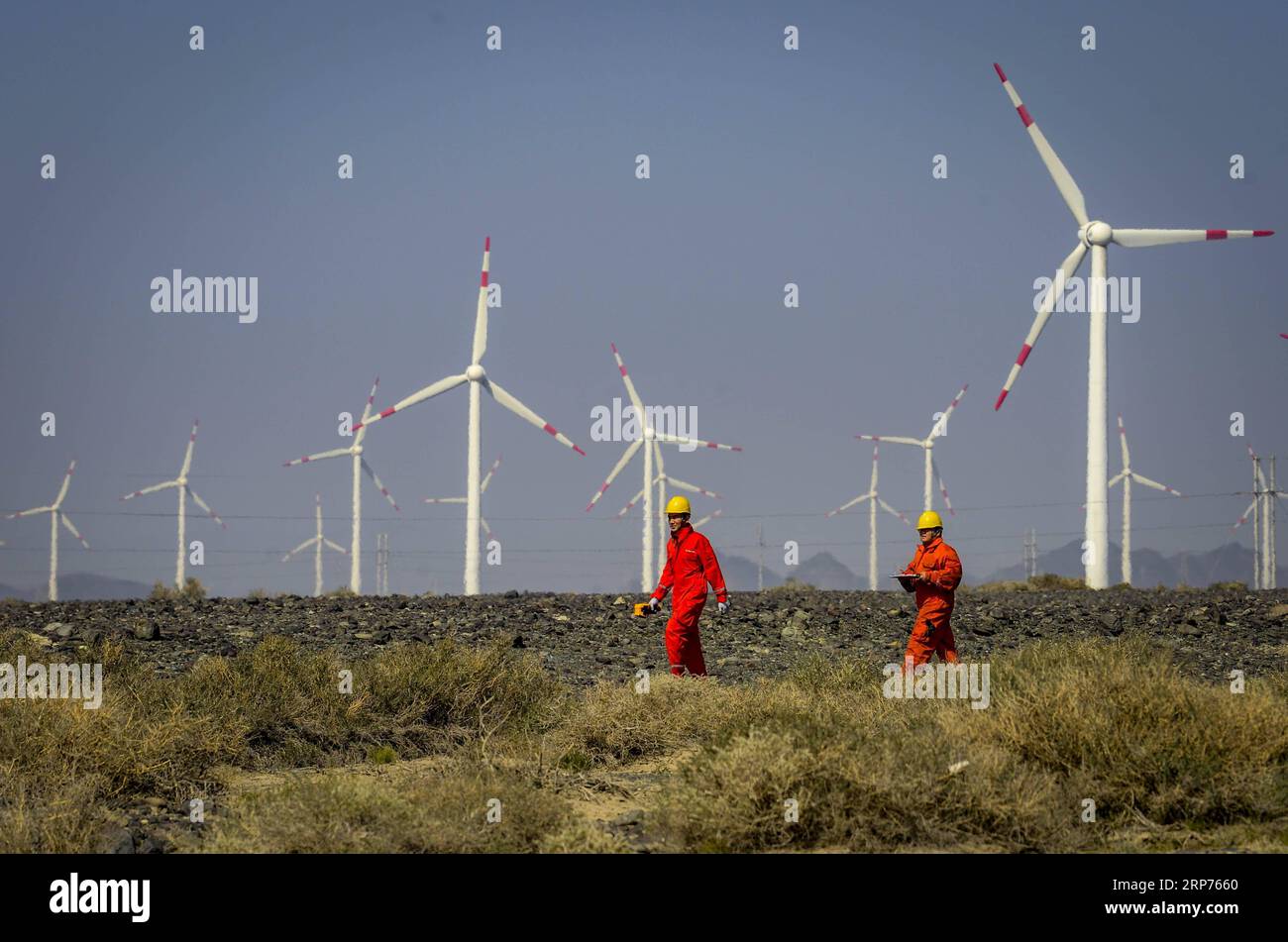(190129) -- BEIJING, Jan. 29, 2019 (Xinhua) -- Workers check equipment at a wind power plant in Urumqi, northwest China s Xinjiang Uygur Autonomous Region, Sept. 18, 2018. New energy power generation saw double digit growth last year in northwest China s Xinjiang Uygur Autonomous Region amid efforts to reduce coal consumption to improve the energy mix. Wind and solar power generation rose 15.2 percent and 13.6 percent to 36 billion kwh and 11.7 billion kwh respectively, according to the regional development and reform commission. It said 22.9 percent of installed wind power generating capacity Stock Photo