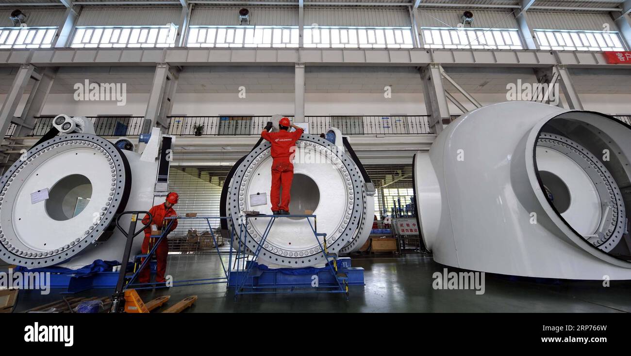 (190129) -- BEIJING, Jan. 29, 2019 (Xinhua) -- File photo taken on May 11, 2011 shows the producing department of Goldwind Science and Technology Co.,Ltd. in Urumqi, capital of northwest China s Xinjiang Uygur Autonomous Region. New energy power generation saw double digit growth last year in Xinjiang amid efforts to reduce coal consumption to improve the energy mix. Wind and solar power generation rose 15.2 percent and 13.6 percent to 36 billion kwh and 11.7 billion kwh respectively, according to the regional development and reform commission. It said 22.9 percent of installed wind power gene Stock Photo