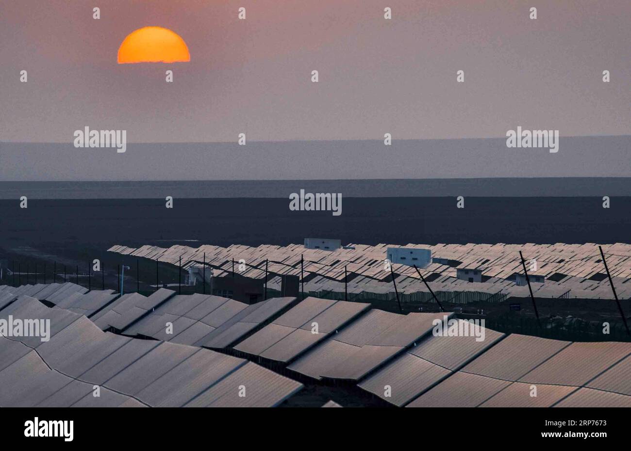 (190129) -- BEIJING, Jan. 29, 2019 (Xinhua) -- Photo taken on Sept. 18, 2018 shows a photovoltaic power plant in Turpan, northwest China s Xinjiang Uygur Autonomous Region. New energy power generation saw double digit growth last year in northwest China s Xinjiang Uygur Autonomous Region amid efforts to reduce coal consumption to improve the energy mix. Wind and solar power generation rose 15.2 percent and 13.6 percent to 36 billion kwh and 11.7 billion kwh respectively, according to the regional development and reform commission. It said 22.9 percent of installed wind power generating capacit Stock Photo