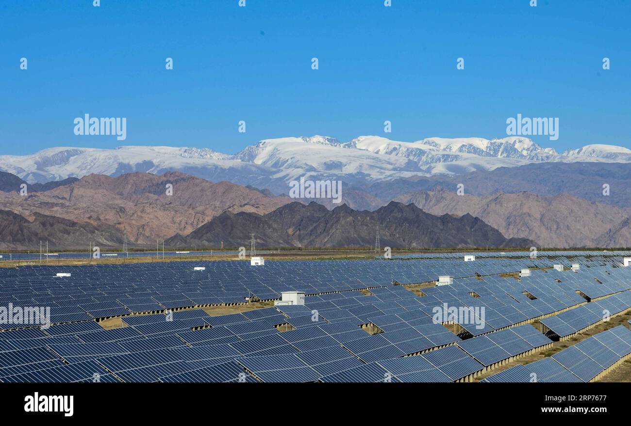 (190129) -- BEIJING, Jan. 29, 2019 (Xinhua) -- Photo taken on Sept. 20, 2018 shows a photovoltaic power plant in Hami, northwest China s Xinjiang Uygur Autonomous Region. New energy power generation saw double digit growth last year in northwest China s Xinjiang Uygur Autonomous Region amid efforts to reduce coal consumption to improve the energy mix. Wind and solar power generation rose 15.2 percent and 13.6 percent to 36 billion kwh and 11.7 billion kwh respectively, according to the regional development and reform commission. It said 22.9 percent of installed wind power generating capacity Stock Photo