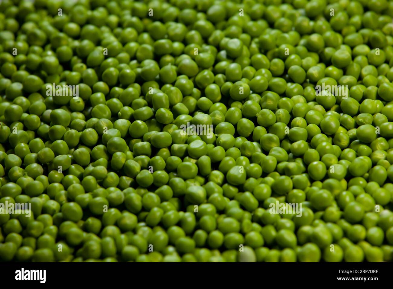 Sweet green peas background. Selective focus. Stock Photo