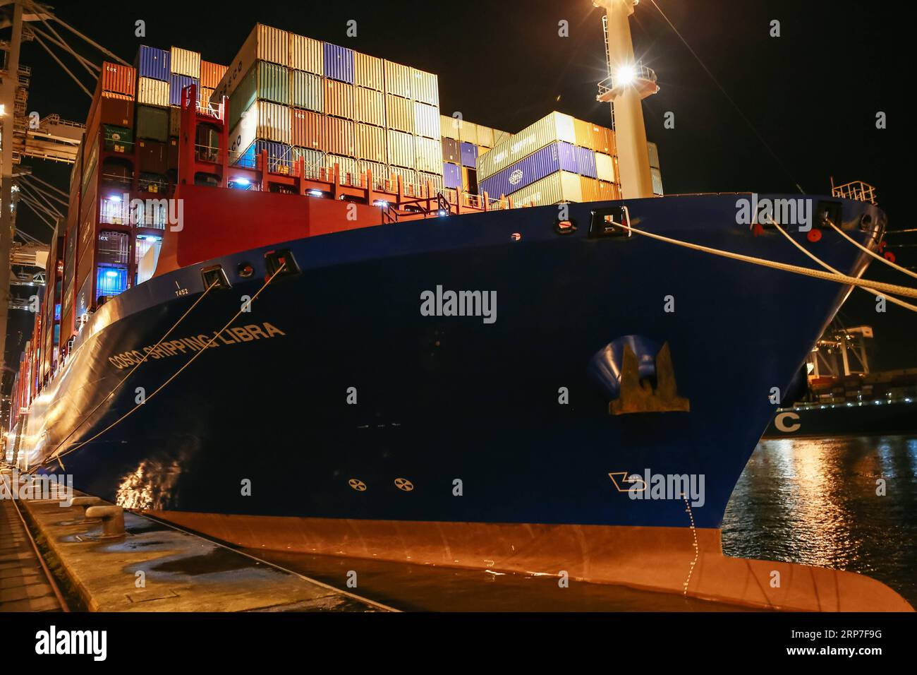 (190206) -- ANTWERP, Feb. 6, 2019 -- Photo taken on Feb. 5, 2019 shows COSCO SHIPPING LIBRA at the Port of Antwerp in Belgium. China s 20,000 plus twenty-foot equivalent unit (TEU) container vessel COSCO SHIPPING LIBRA docked at the Port of Antwerp on Tuesday. ) BELGIUM-ANTWERP-COSCO CONTAINERSHIP ZhangxCheng PUBLICATIONxNOTxINxCHN Stock Photo