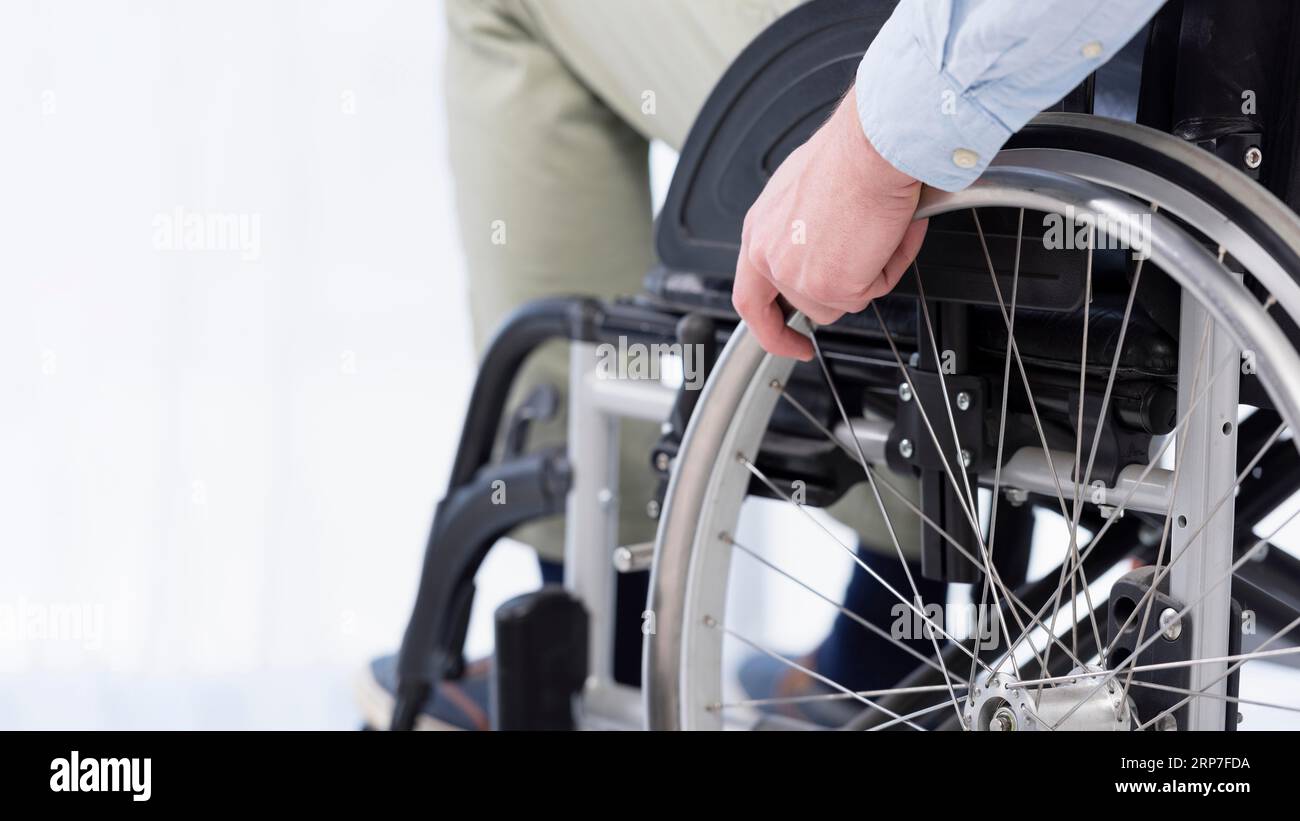Hand wheelchair wheel Stock Photo Alamy