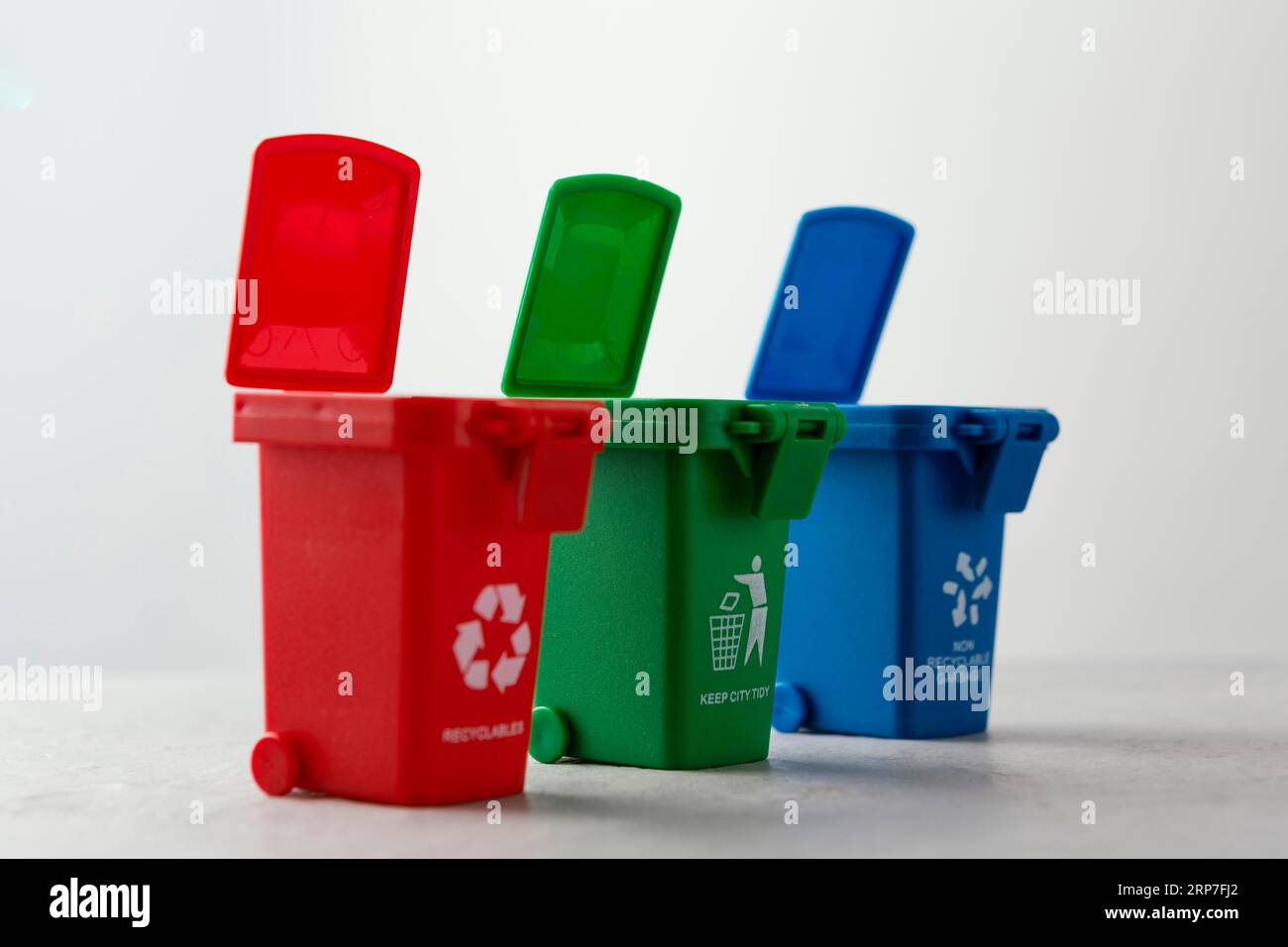 Three miniature recycle bins Stock Photo Alamy