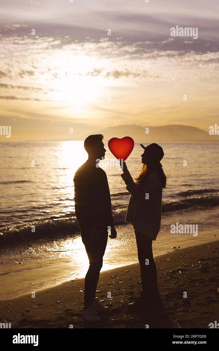 Romantic couple heart balloon hi-res stock photography and images - Alamy