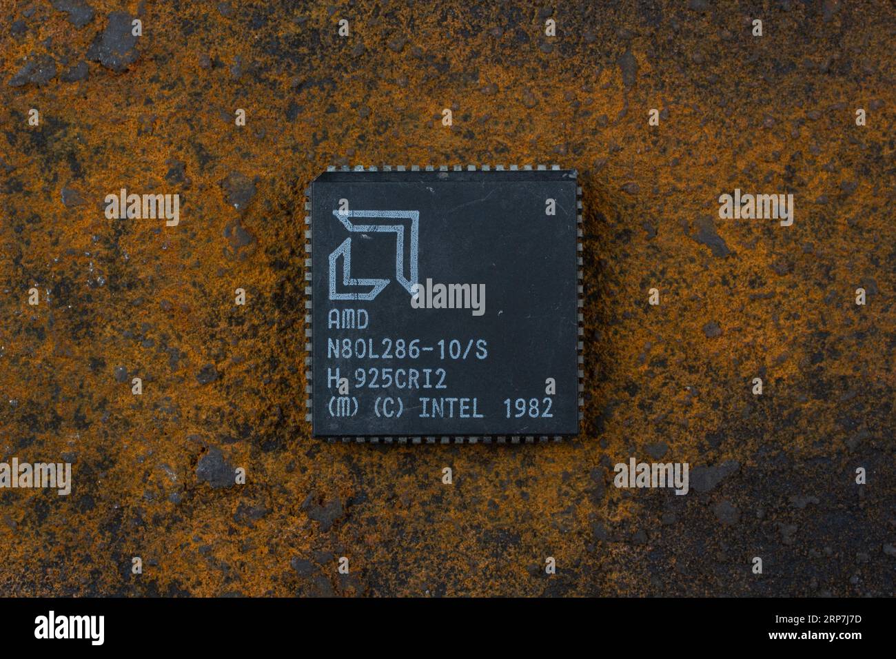 KYIV, UKRAINE - August 2, 2023. AMD 286 processor unit on rusty background. Stock Photo