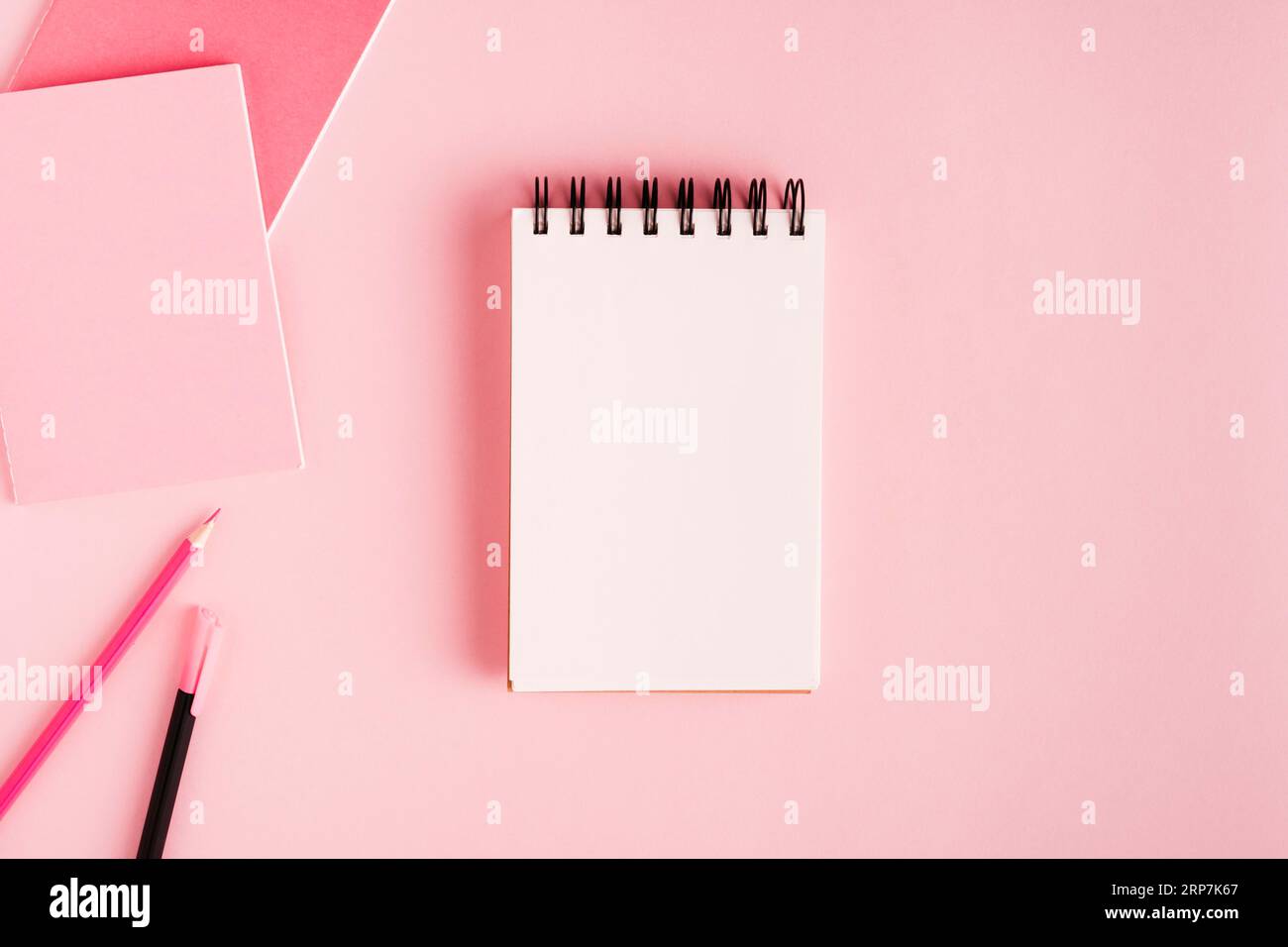 Notepad office supplies colored surface Stock Photo