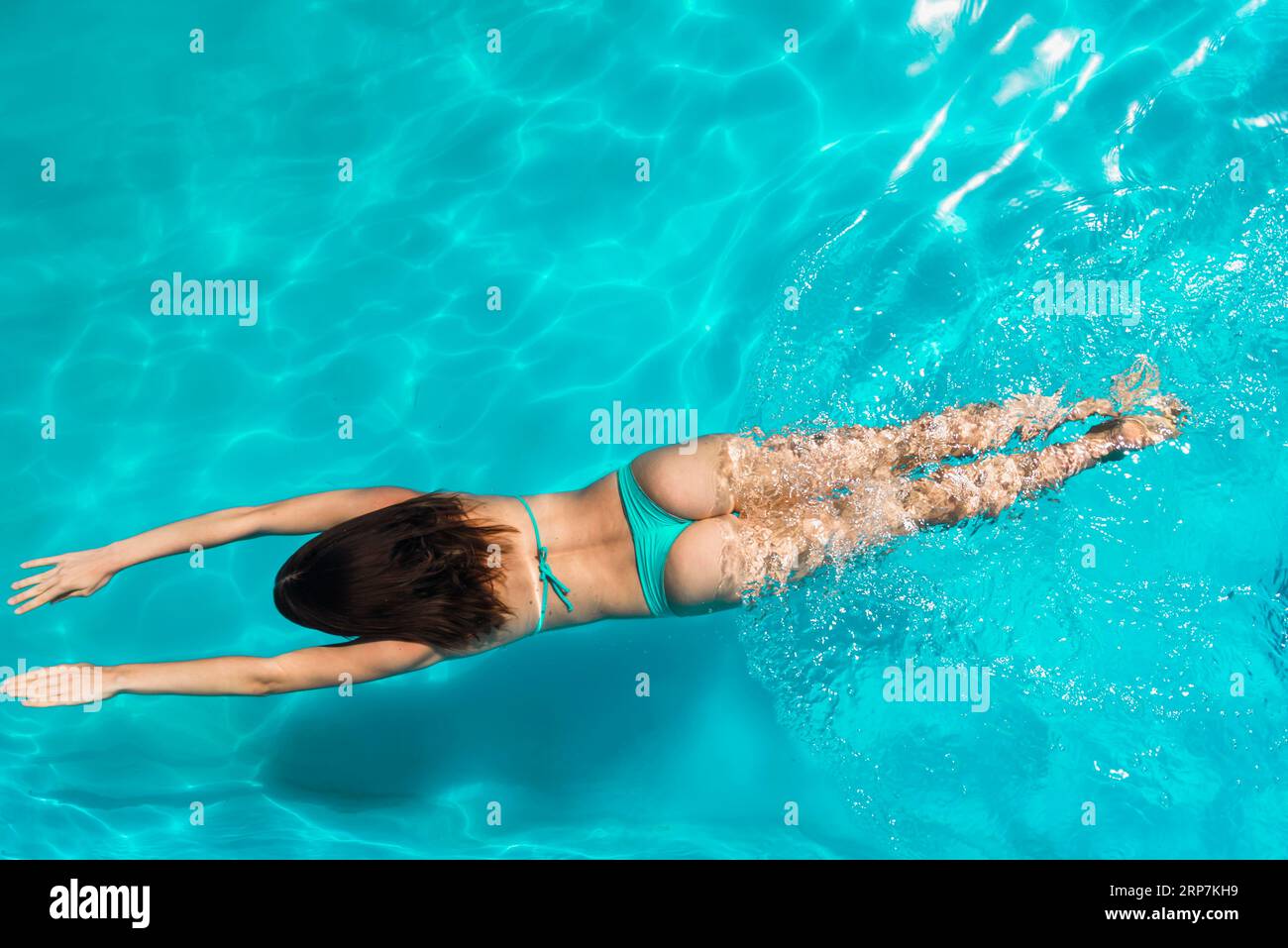 Adult female swimming bright clear water Stock Photo