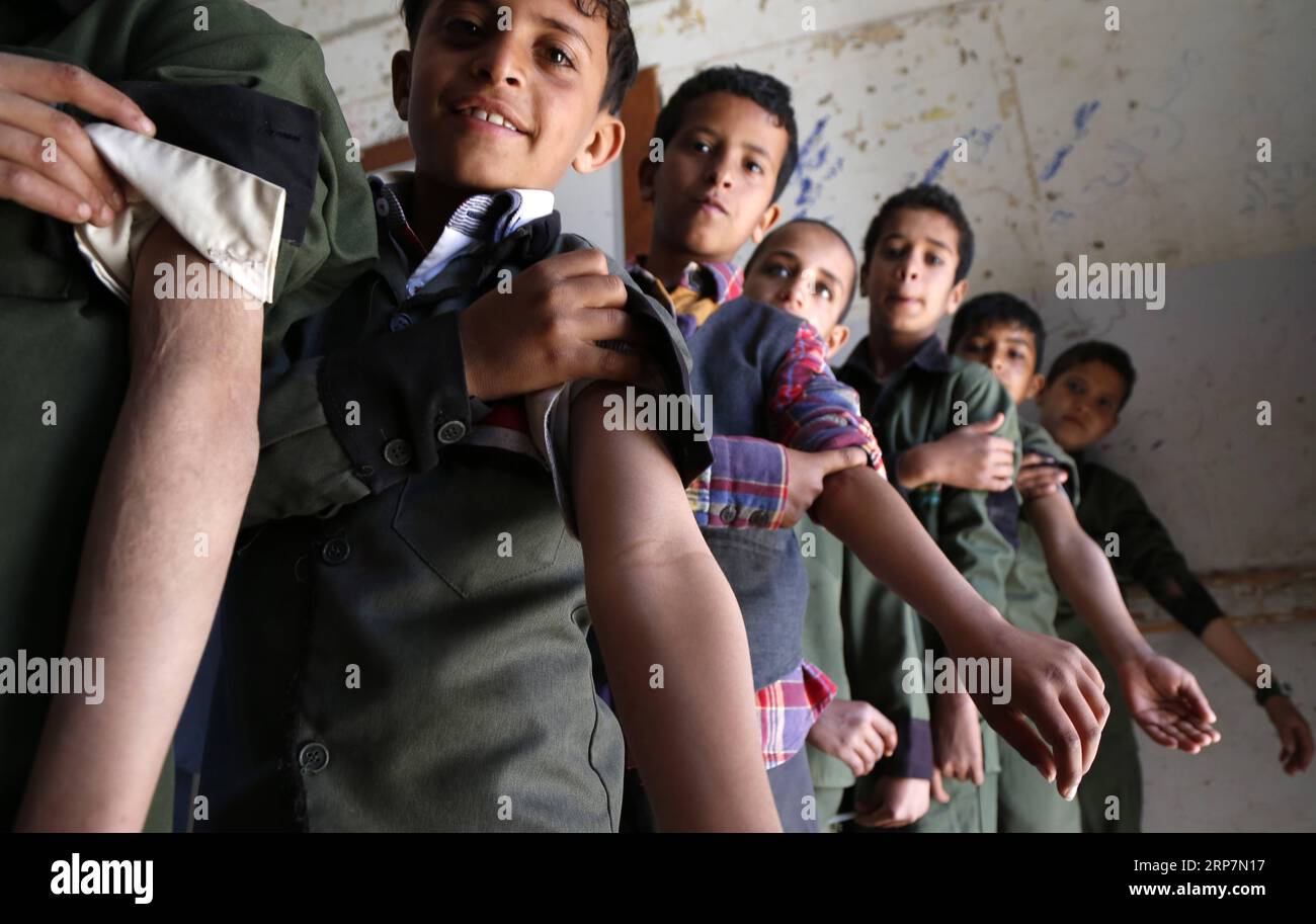 (190209) -- SANAA, Feb. 9, 2019 -- Yemeni students prepare to receive anti-measles and rubella vaccine in a school in Sanaa, Yemen, on Feb. 9, 2019. A National Measles and Rubella Immunization Campaign kicked off on Saturday in Yemen and will last six days. The campaign targets Yemeni children from the age of six months to 15 years, according to the local media. Mohammed Mohammed) YEMEN-SANAA-MEASLES-RUBELLA-VACCINATION nieyunpeng PUBLICATIONxNOTxINxCHN Stock Photo