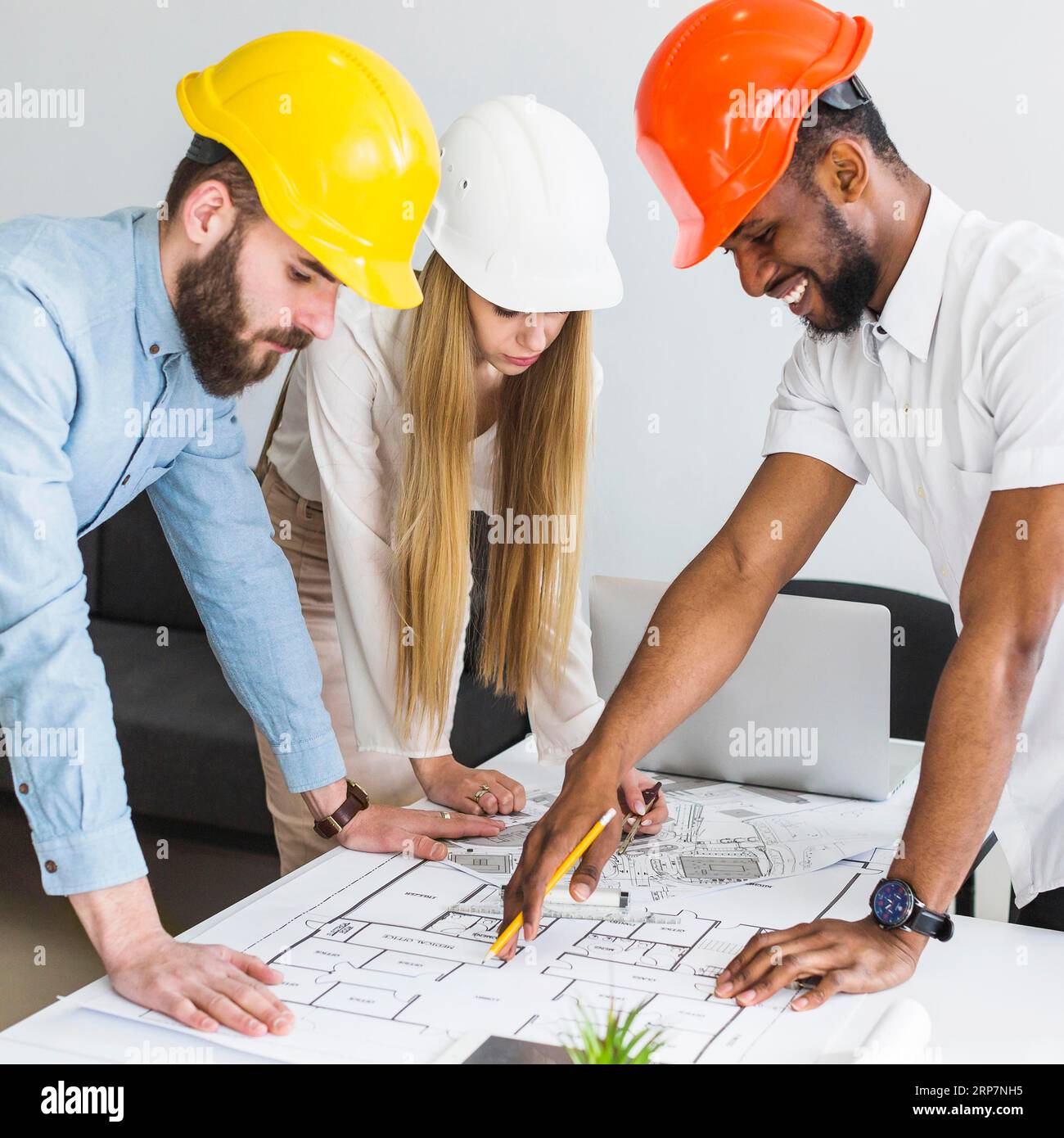 Group architect discussing layout plan blueprint office Stock Photo
