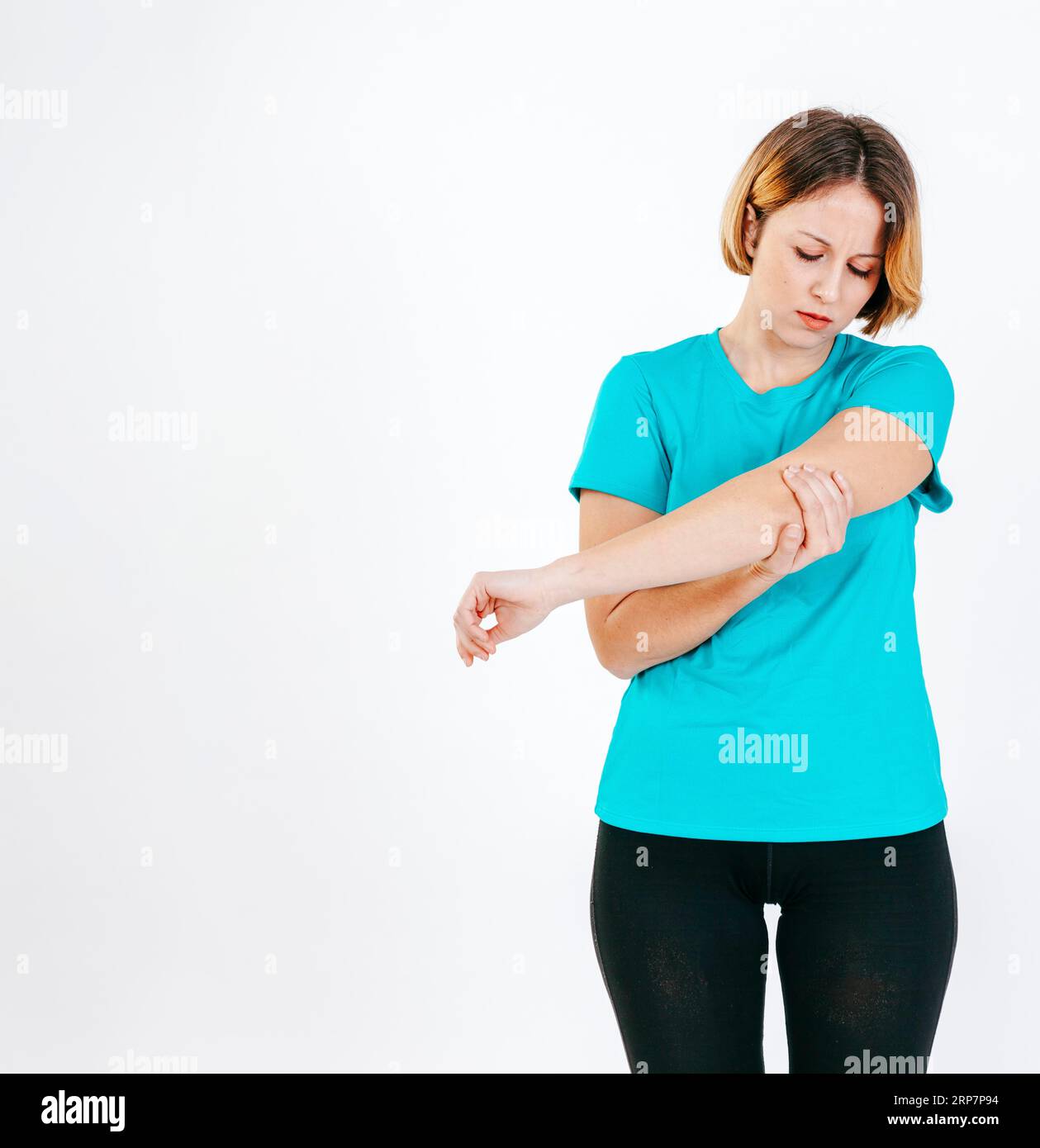 Pretty woman with hurting elbow Stock Photo