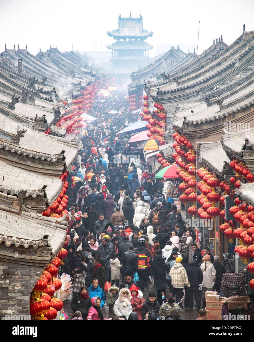 190210 -- JINZHONG, Feb. 10, 2019 -- Tourists visit Pingyao, a tourist attraction in north China s Shanxi Province, Feb. 10, 2019. China s domestic tourism revenue gained 513.9 billion yuan about 76.21 billion U.S. dollars during the week-long Spring Festival holiday that ends Sunday, an annual increase of 8.2 percent, according to the Ministry of Culture and Tourism. A total of 415 million trips were made across the country during the holiday, rising by 7.6 percent year on year, according to the ministry. Traditional culture was one of the travelers favorites during the holiday, as a survey b Stock Photo