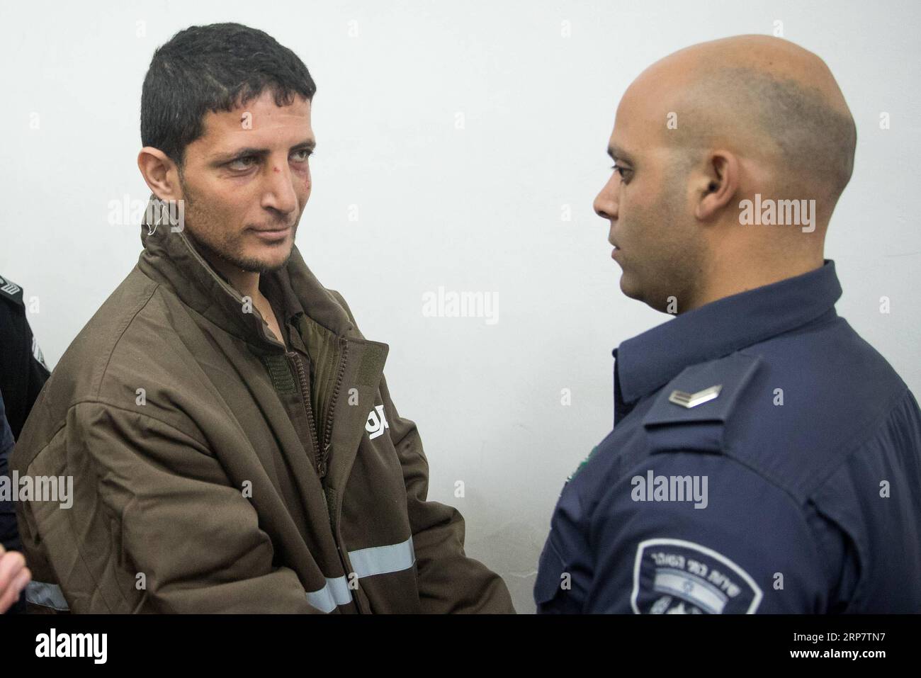 (190211) -- JERUSALEM, Feb. 11, 2019 -- Arafat Irfayia (L) appears at a courtroom in Jerusalem, on Feb. 11, 2019. Israel s Shin Bet security service said on Sunday that the killing of a young Israeli woman last week was a terrorist attack carried out by Arafat Irfayia. The Shin Bet said that the interrogation of Arafat Irfayia, arrested on Friday in the West Bank city of Ramallah, showed the killing was nationalistically-motivated. ) MIDEAST-JERUSALEM-KILLING-CHARGE JINI PUBLICATIONxNOTxINxCHN Stock Photo