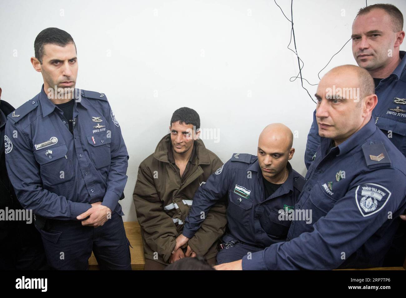 (190211) -- JERUSALEM, Feb. 11, 2019 -- Arafat Irfayia (2nd L) appears at a courtroom in Jerusalem, on Feb. 11, 2019. Israel s Shin Bet security service said on Sunday that the killing of a young Israeli woman last week was a terrorist attack carried out by Arafat Irfayia. The Shin Bet said that the interrogation of Arafat Irfayia, arrested on Friday in the West Bank city of Ramallah, showed the killing was nationalistically-motivated. ) MIDEAST-JERUSALEM-KILLING-CHARGE JINI PUBLICATIONxNOTxINxCHN Stock Photo