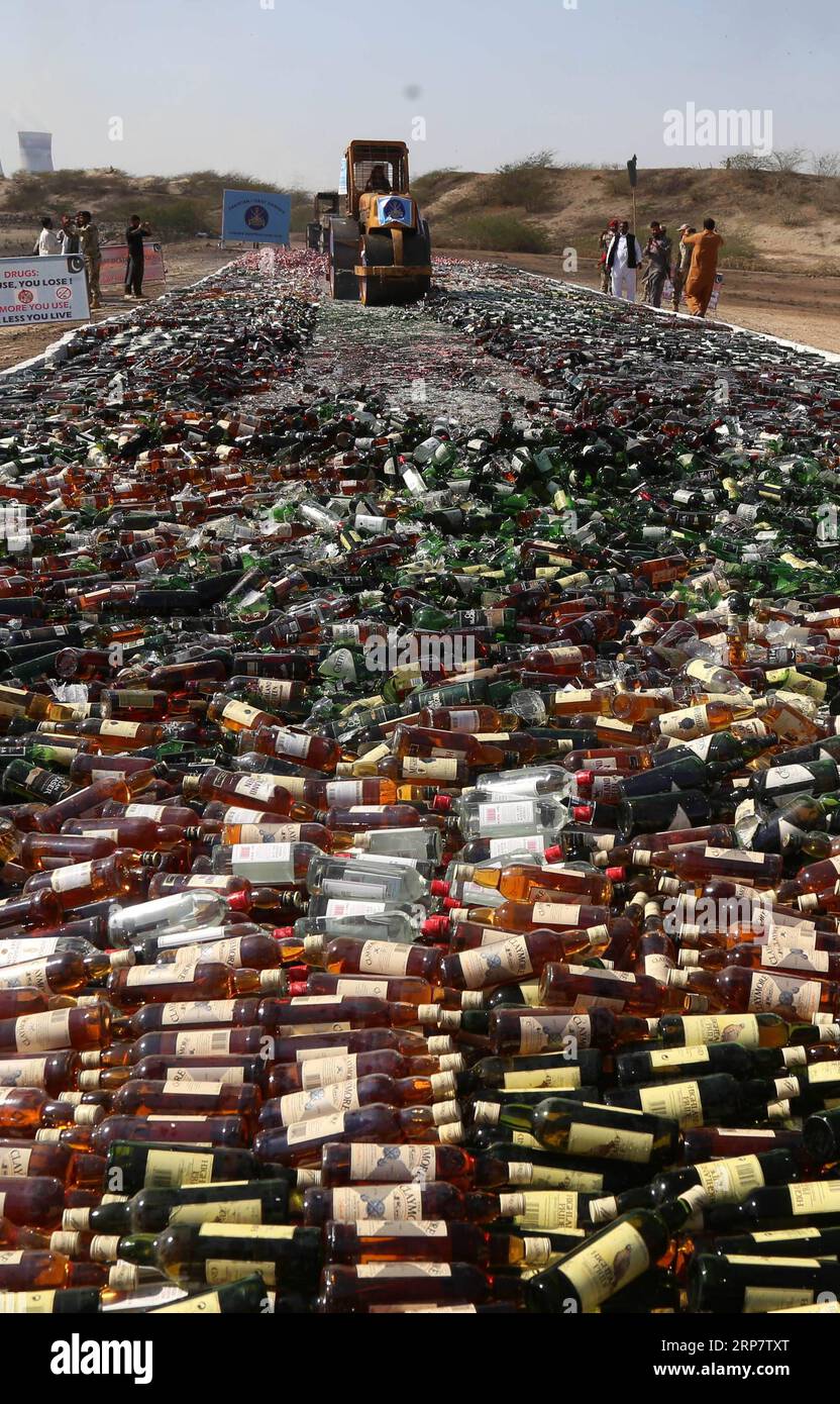 190212-karachi-feb-12-2019-a-steamroller-rolls-over-bottles