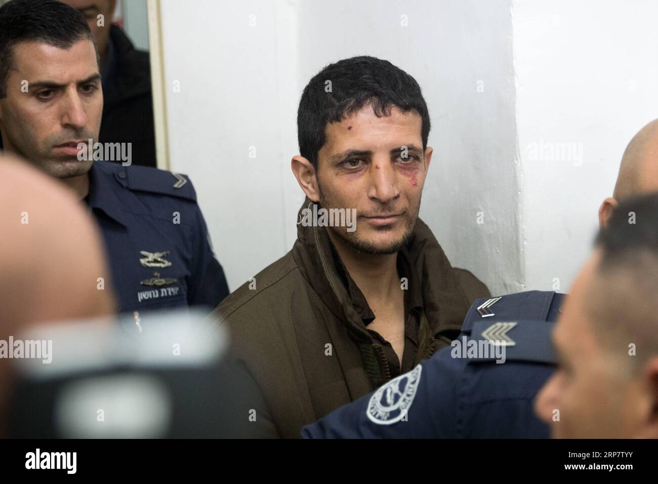 (190211) -- JERUSALEM, Feb. 11, 2019 -- Arafat Irfayia (C) appears at a courtroom in Jerusalem, on Feb. 11, 2019. Israel s Shin Bet security service said on Sunday that the killing of a young Israeli woman last week was a terrorist attack carried out by Arafat Irfayia. The Shin Bet said that the interrogation of Arafat Irfayia, arrested on Friday in the West Bank city of Ramallah, showed the killing was nationalistically-motivated. ) MIDEAST-JERUSALEM-KILLING-CHARGE JINI PUBLICATIONxNOTxINxCHN Stock Photo