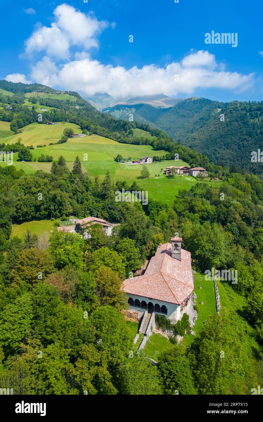 Aerial view of the Santissima Trinità di Parre church on a hill overlooking Valle Seriana. Val Seriana, Bergamo province, Lombardy, Italy. Stock Photo