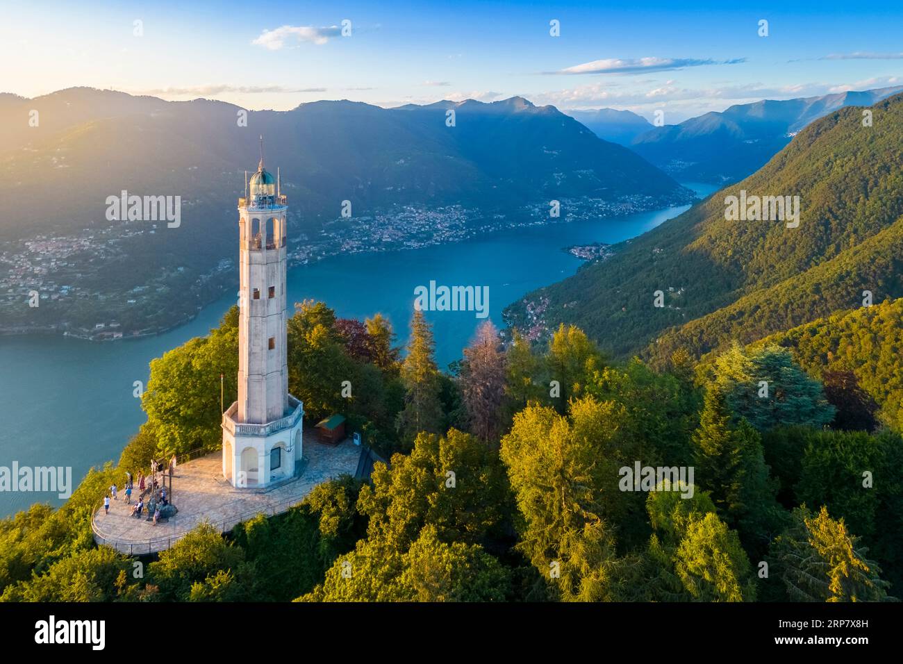 Aerial view of the Faro Voltiano of Brunate overlooking Como and Como Lake in summer at sunset. Brunate, Province of Como, Lombardy, Italy. Stock Photo