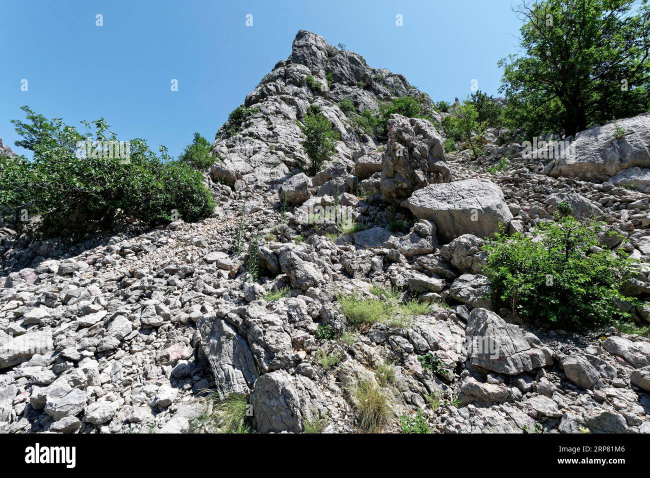 Steep rocks and boulders in the Velebit limestone mountains in Paklenica National Park in northern Dalmatia. Paklenica Starigrad, Dalmatia, Croatia Stock Photo