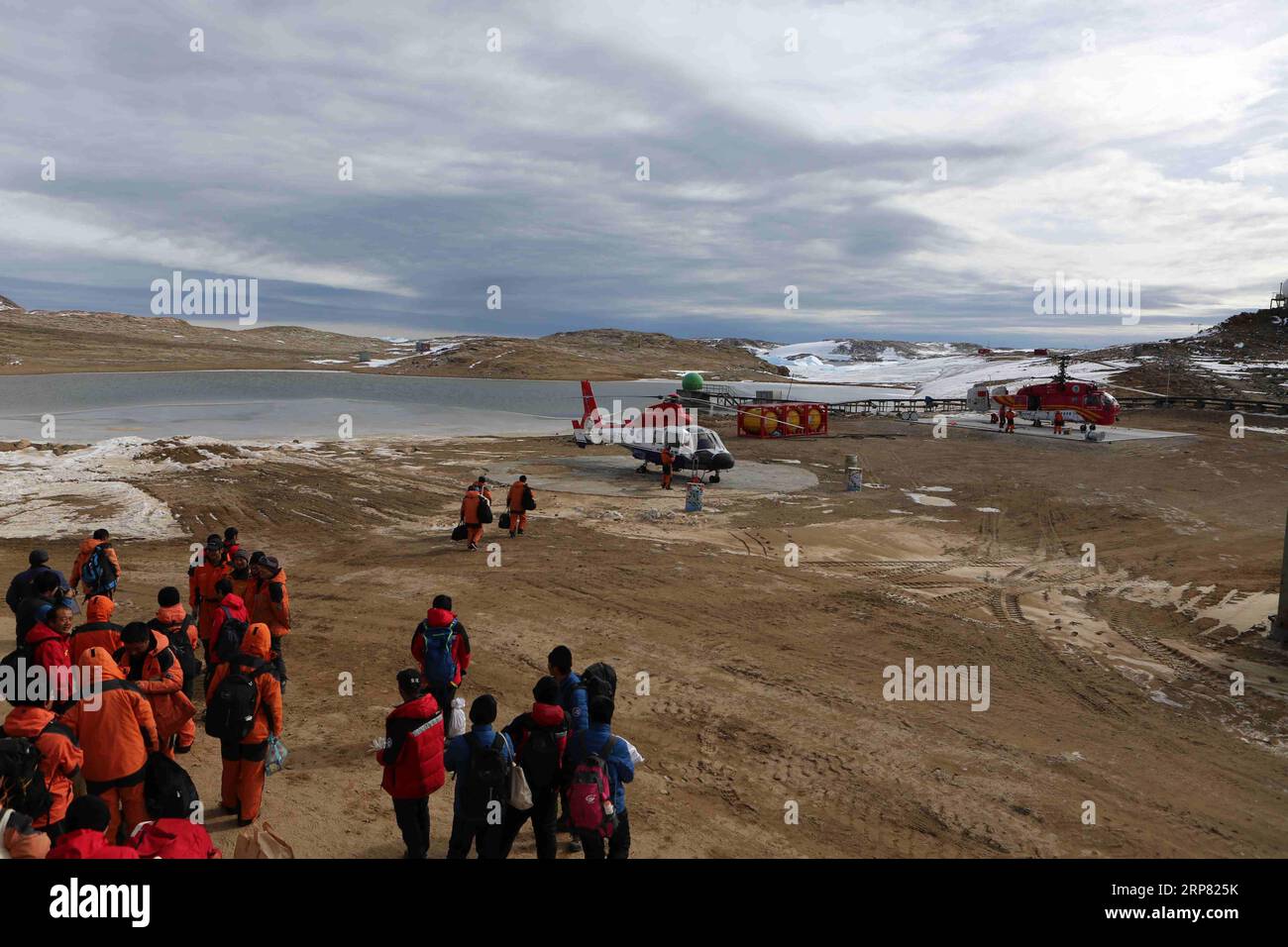 (190215) -- ABOARD XUELONG, Feb. 15, 2019 (Xinhua) -- A helicopter picks up members of China s 35th Antarctic expedition team from the Zhongshan Station to China s research icebreaker Xuelong, Feb. 13, 2019. China s research icebreaker Xuelong, with 126 crew members aboard on the 35th Antarctic research mission, on Thursday local time left the Zhongshan Station on its way back to China. Snow Eagle 601, China s first fixed-wing aircraft for polar flight, on Thursday night also departed from the Antarctic after completing all assignments. (Xinhua/Liu Shiping) ANTARCTICA-SCI-TECH-CHINA-XUELONG-SA Stock Photo