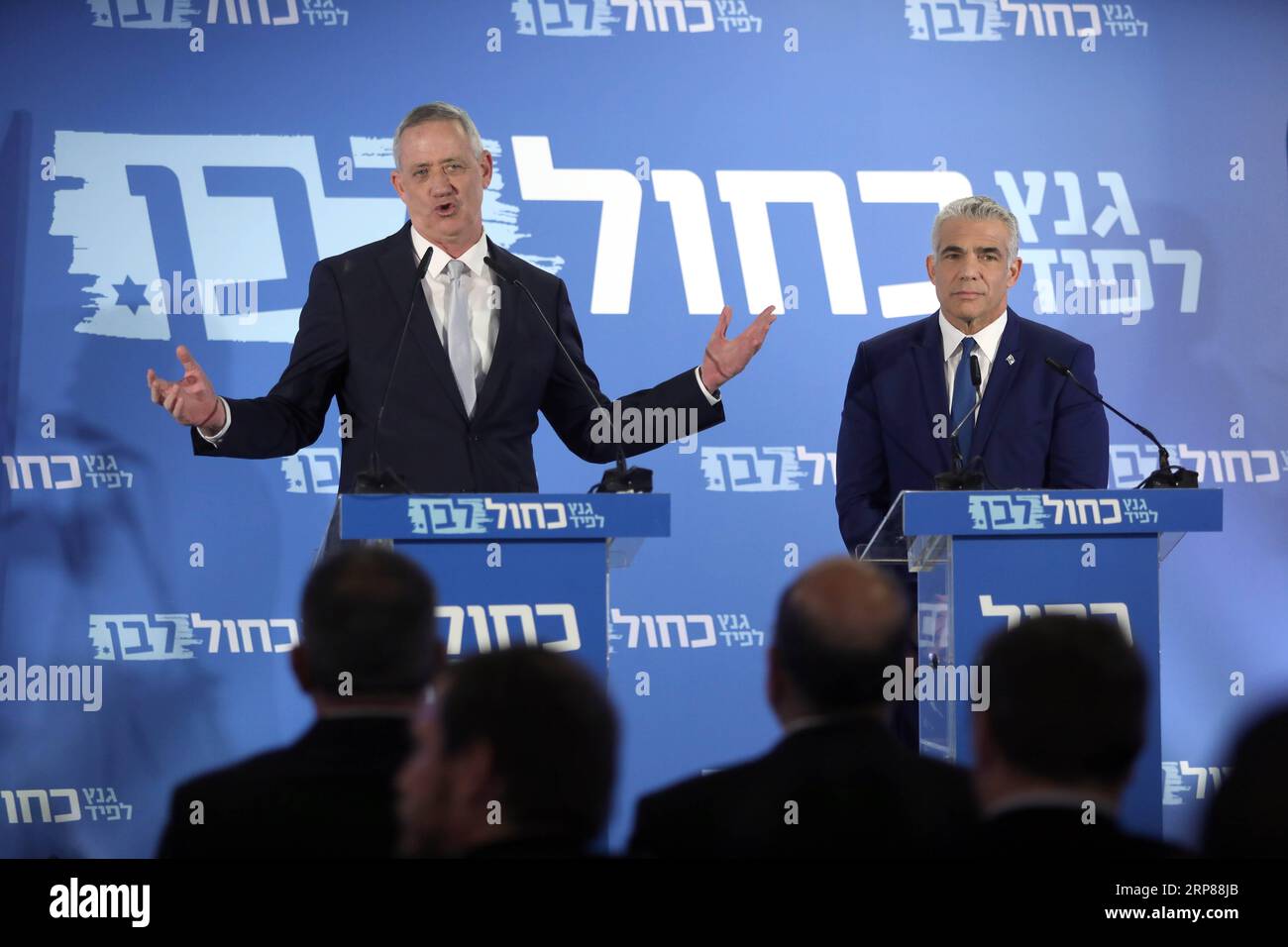 (190221) -- TEL AVIV, Feb. 21, 2019 -- Benny Gantz (L, Rear) and Yair Lapid (R, Rear) react as they deliver a joint statement in Tel Aviv, Israel, on Feb. 21, 2019. Israeli Prime Minister Benjamin Netanyahu s main challengers announced on Thursday that an alliance has been formed for the upcoming elections, the first plausible alternative to Netanyahu s long-time rule. Benny Gantz, 59, Israel s former Chief of the General Staff, and Yair Lapid, chair of centrist party Yesh Atid, announced they would present a joint list for the April 9 elections. ) ISRAEL-TEL AVIV-ELECTIONS-BENNY GANTZ-YAIR LA Stock Photo