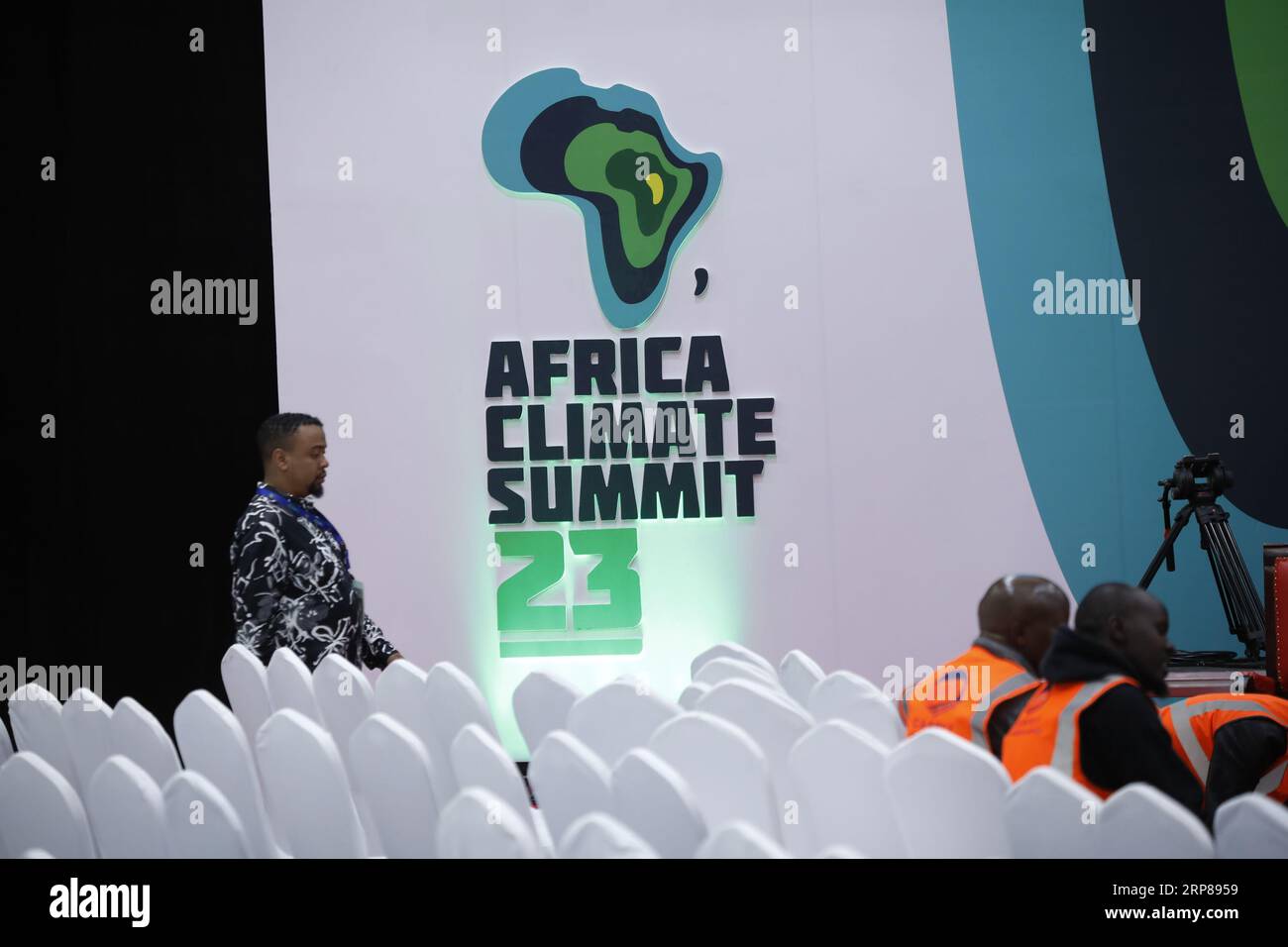 An organizer seen walking past the Africa Climate Summit logo ahead of the African Climate Summit 2023 at the Kenyatta International Conference Centre in Nairobi. The summit will kick off on September 4, 2023 under the theme 'Driving Green Growth and Climate Finance Solutions for Africa and the World'. Stock Photo