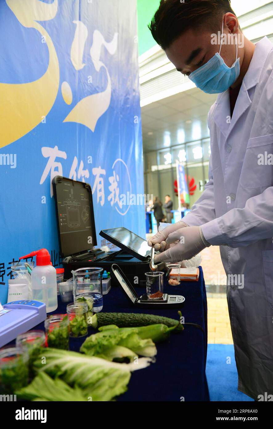 (190225) -- BEIJING, Feb. 25, 2019 (Xinhua) -- A technician checks the content of sulfur dioxide in food during an activity in Nanning, capital of south China s Guangxi Zhuang Autonomous Region, March 15, 2017, the International Consumer Rights Day. China has unveiled a guideline to enhance the accountability system of local governments to strengthen supervision over food safety. Food safety will be included in the performance assessment of the Party and government leading officials, according to the guideline released by the Central Committee of the Communist Party of China (CPC) and the Stat Stock Photo