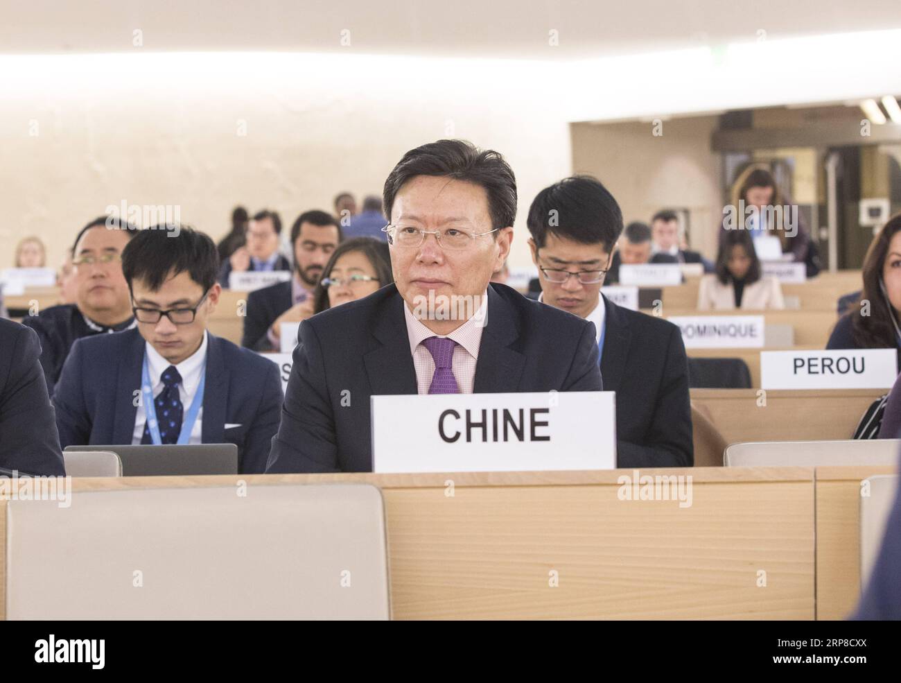 (190228) -- GENEVA, Feb. 28, 2019 (Xinhua) -- Yu Jianhua, head of the Chinese Mission to the UN Office in Geneva, attends the 40th session of the UN Human Rights Council (UNHRC) in Geneva, Switzerland, Feb. 27, 2019. The 56 ethnic groups in China, living together like brothers and sisters, are all parts of the big family of the Chinese nation, Yu Jianhua told the UNHRC session. The people of all ethnic groups are tightly held together like pomegranate seeds, and together they are making arduous efforts for the great rejuvenation of the Chinese nation where they can all live a happy life, Yu sa Stock Photo