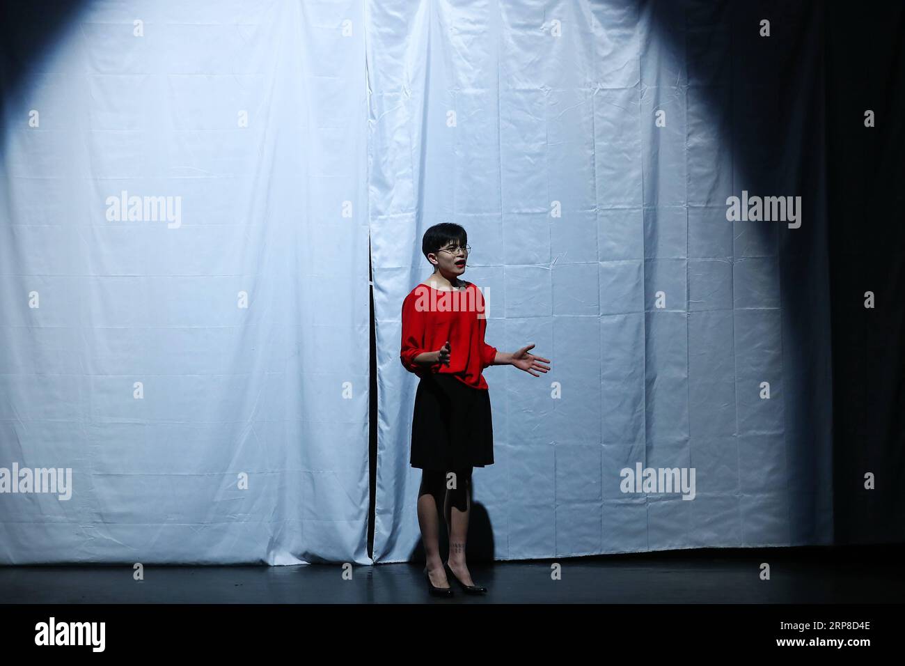 (190228) -- BEIJING, Feb. 28, 2019 (Xinhua) -- Rare disease patient Pan Longfei tells his stories during his performance in Rare Hug , a drama on rare diseases, at Beijing Tianqiao Performance Arts Center in Beijing, capital of China, Feb. 27, 2019. Rare Hug, a Chinese drama on rare diseases, was staged at the Beijing Tianqiao Performing Arts Center Wednesday evening to mark the 12th Rare Disease Day, which falls on Feb. 28, 2019 under the theme Bridging Health and Social Care. The drama was played by rare disease patients in collaboration with their relatives. Assisted by two volunteer direct Stock Photo