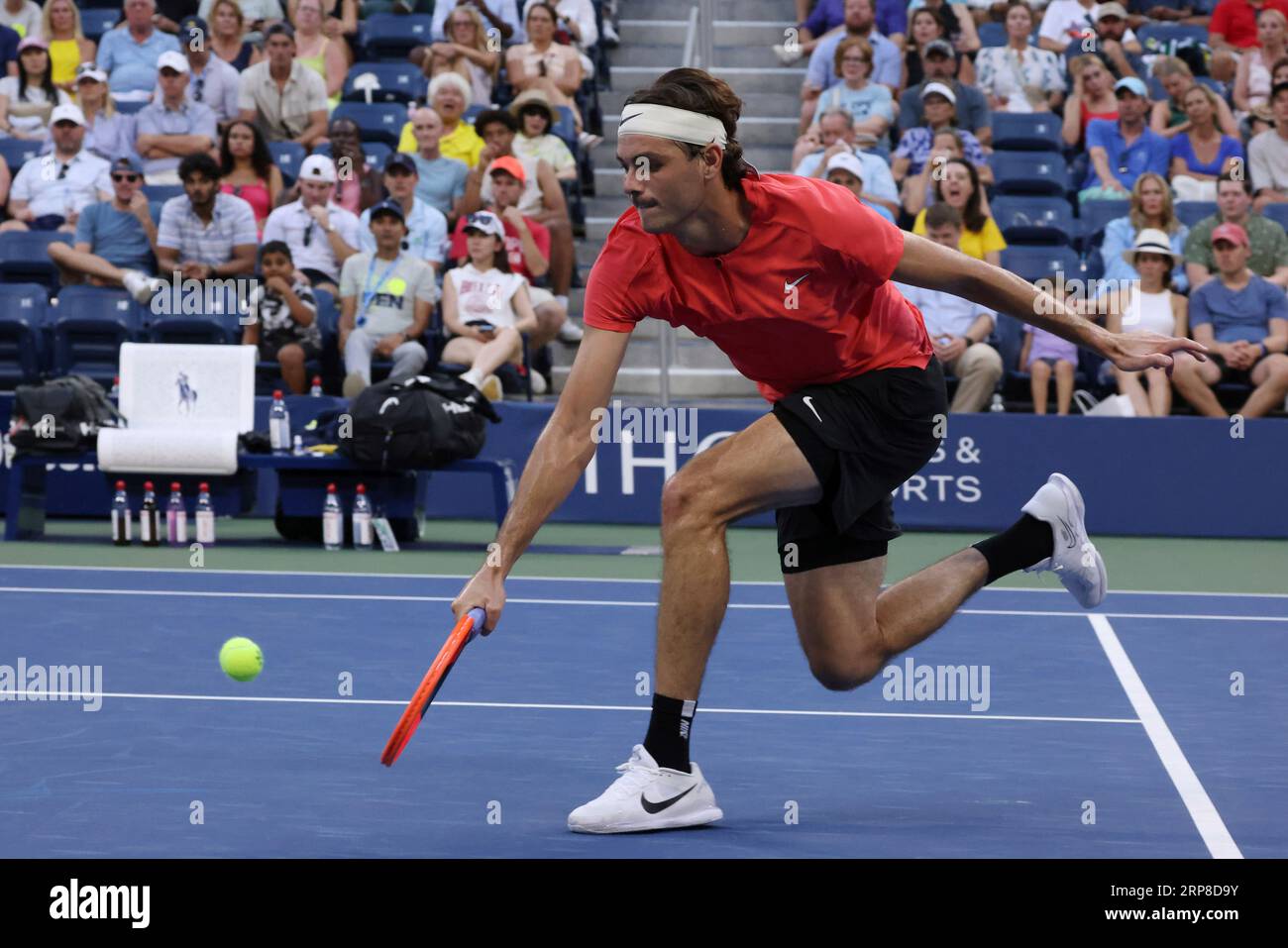 Taylor Fritz, of the United States, returns to Dominic Stricker, of ...