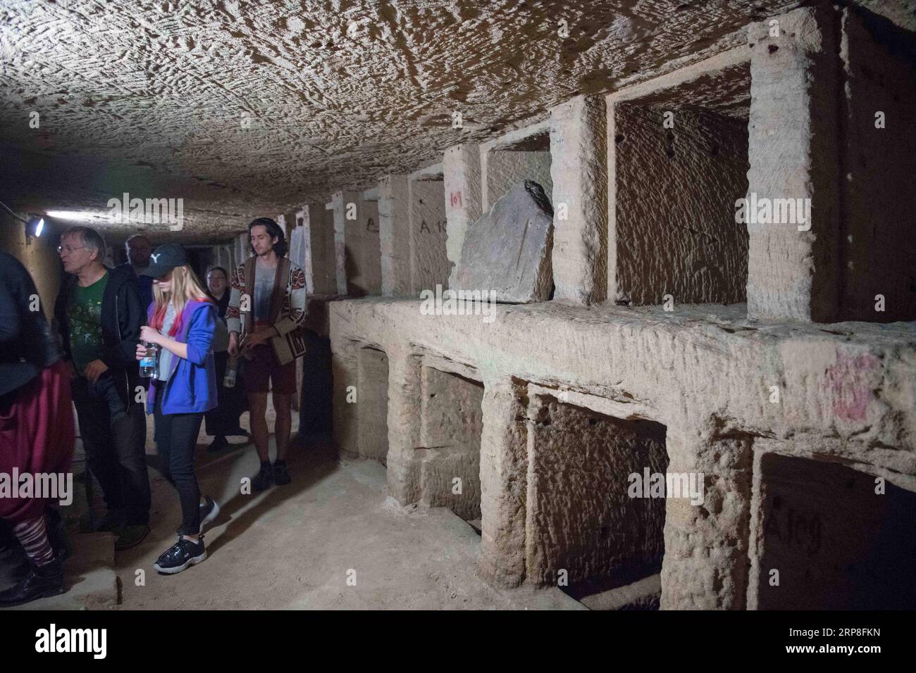 (190303) -- ALEXANDRIA (EGYPT), March 3, 2019 -- People visit the catacombs of ancient Kom al-Shoqafa tombs in the northern seaside Alexandria province, Egypt, on March 3, 2019. The Egyptian Ministry of Antiquities celebrated on Sunday the completion of a project removing underground water from 2,000-year-old catacombs in the northern seaside province of Alexandria dating back to the Greco-Roman era. ) EGYPT-ALEXANDRIA-GRECO-ROMAN CATACOMBS WuxHuiwo PUBLICATIONxNOTxINxCHN Stock Photo