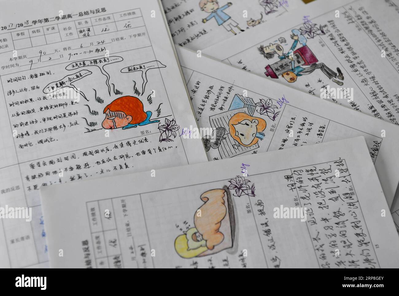 (190305) -- NANJING, March 5, 2019 (Xinhua) -- Comments with hand-drawn comics made by Yu Xiaolan are seen on student assignments at the Nanjing School for the Deaf in Nanjing, capital of east China s Jiangsu Province, March 4, 2019. Having spent 17 years with hearing-impaired students at the Nanjing School for the Deaf, Yu Xiaolan has never regretted her choice as a teacher here. I still remember the day when I came to the campuse for the job interview, said Yu, I could see students running on the playground, just like the normal kids of other schools, but I couldn t hear even a small sound. Stock Photo