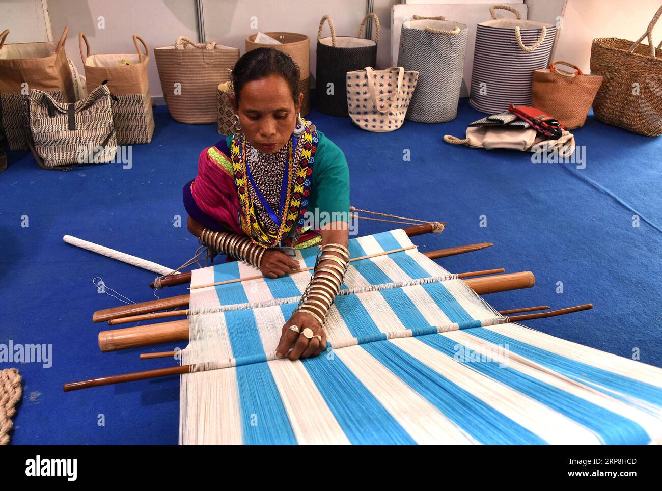 (190306) -- DHAKA, March 6, 2019 () -- A woman makes jute products during a jute fair in Dhaka, Bangladesh, on March 6, 2019. The Bangladeshi government on Wednesday observed the National Jute Day for the third consecutive year to boost domestic use of the golden fiber. () BANGLADESH-DHAKA-NATIONAL JUTE DAY Xinhua PUBLICATIONxNOTxINxCHN Stock Photo